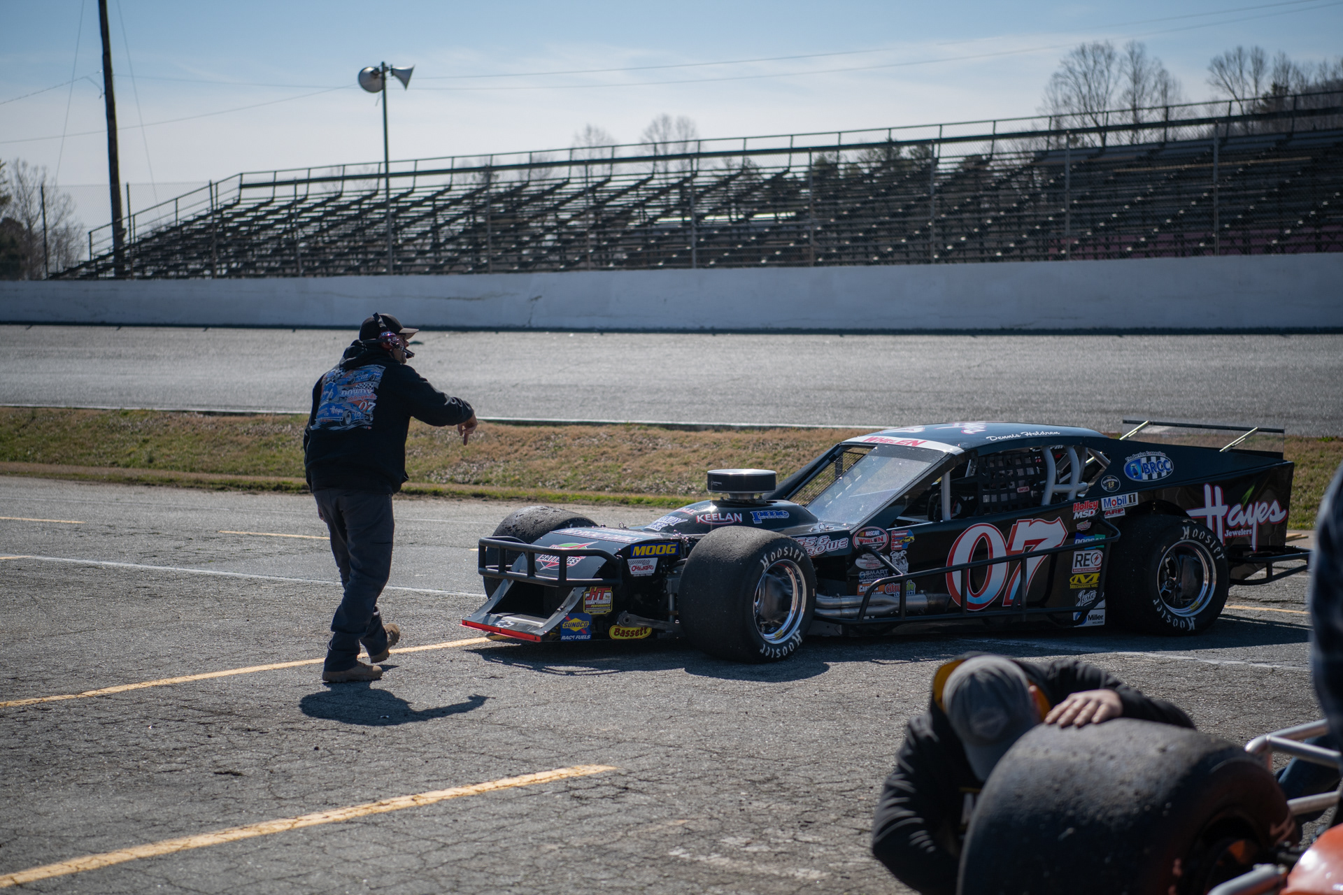 Bradly Eubanks directs Dennis Holdren out of pit during open testing at Caraway Speedway in Sophia, N.C. on March 6, 2021.