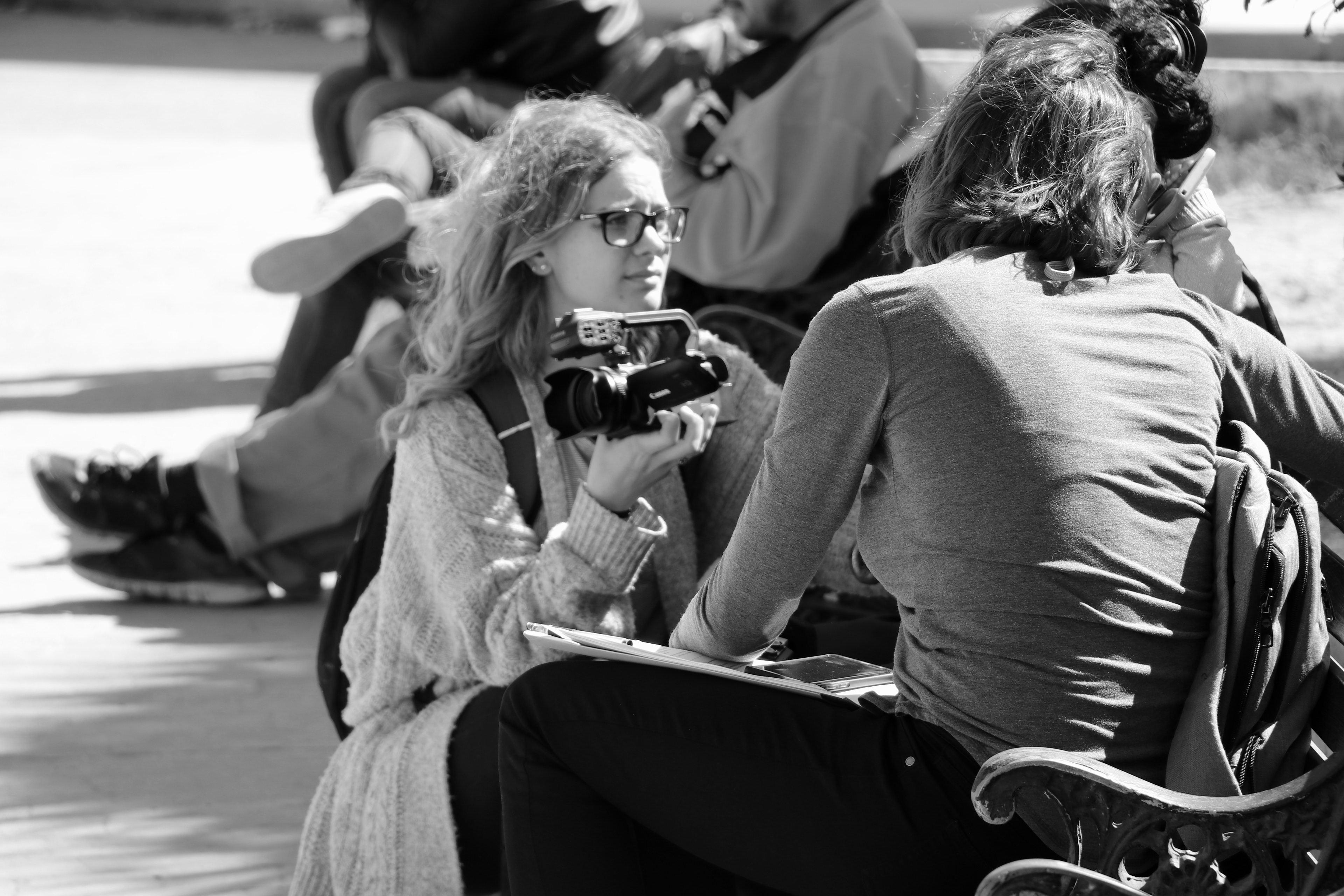 Documentary film crew talking to asylum seekers.