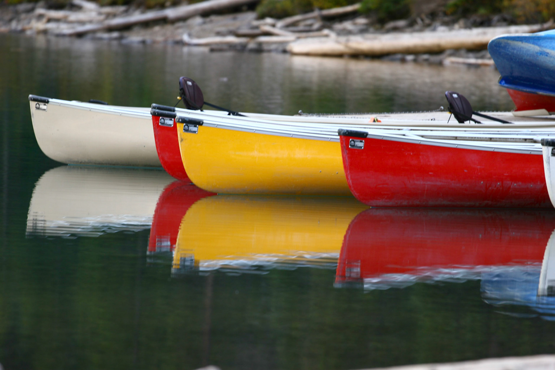 Boats at Lake Moraine at Banff national park with reflection on the water