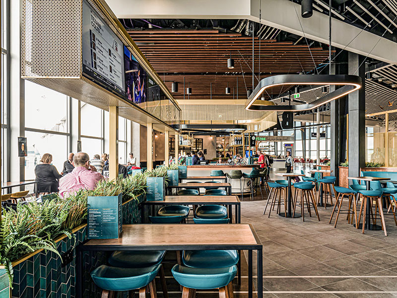 The main bar has a brass / chain lighting feature overhead to create a presence and soft lighting.