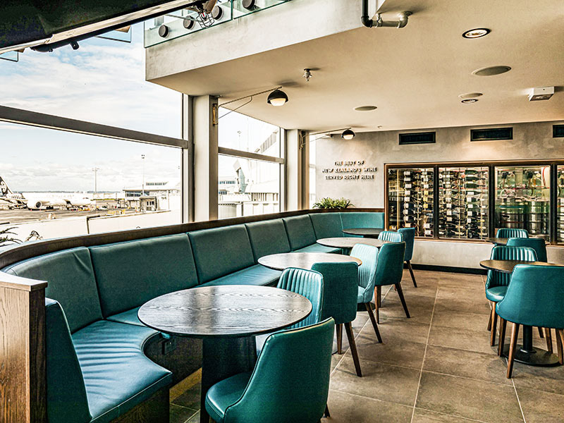 Under the mezzanine the back wall has been turned into an illuminated cool room to showcase the wine offering. Cosy low booth seating against the window to work with the low 2400m ceiling height.