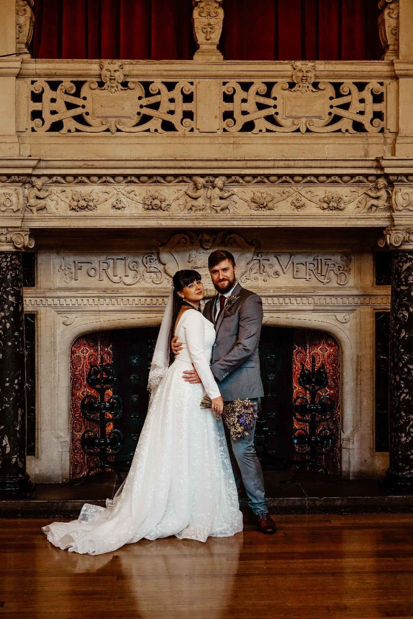 bride and groom stood in town hall in oxford with david lefebvre on their intimate covid wedding day in december during covid