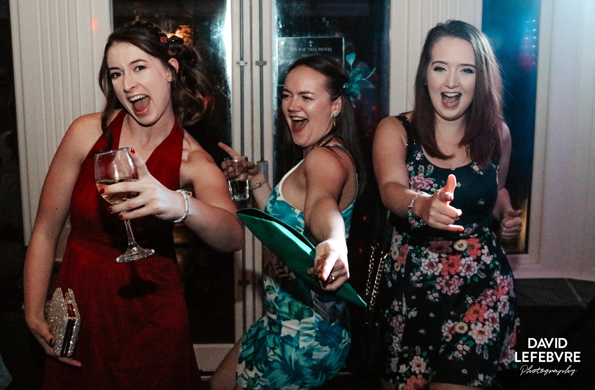 girls dancing pointing at bay tree wedding