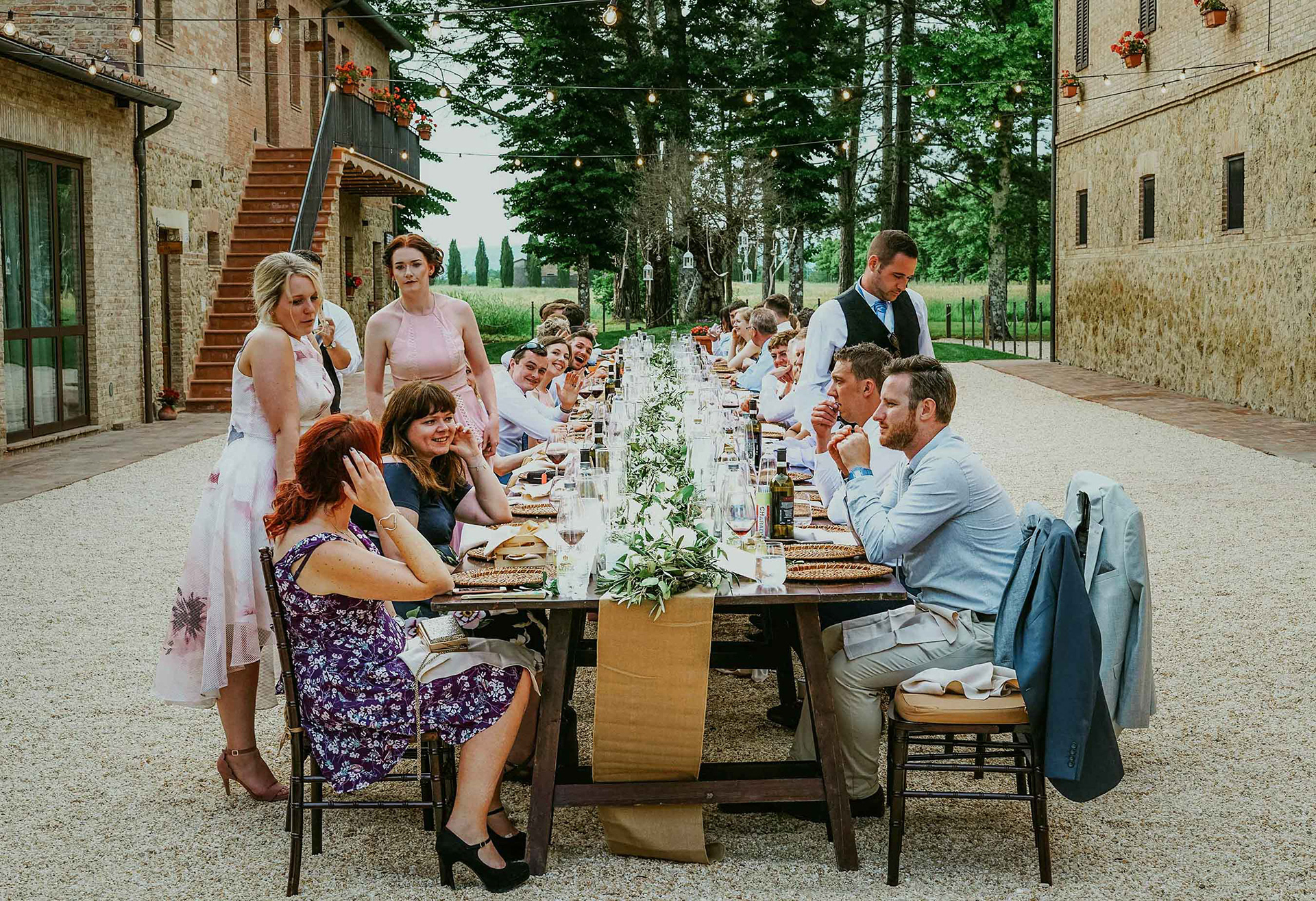 beautiful wedding table with guests at san galgano abbey
