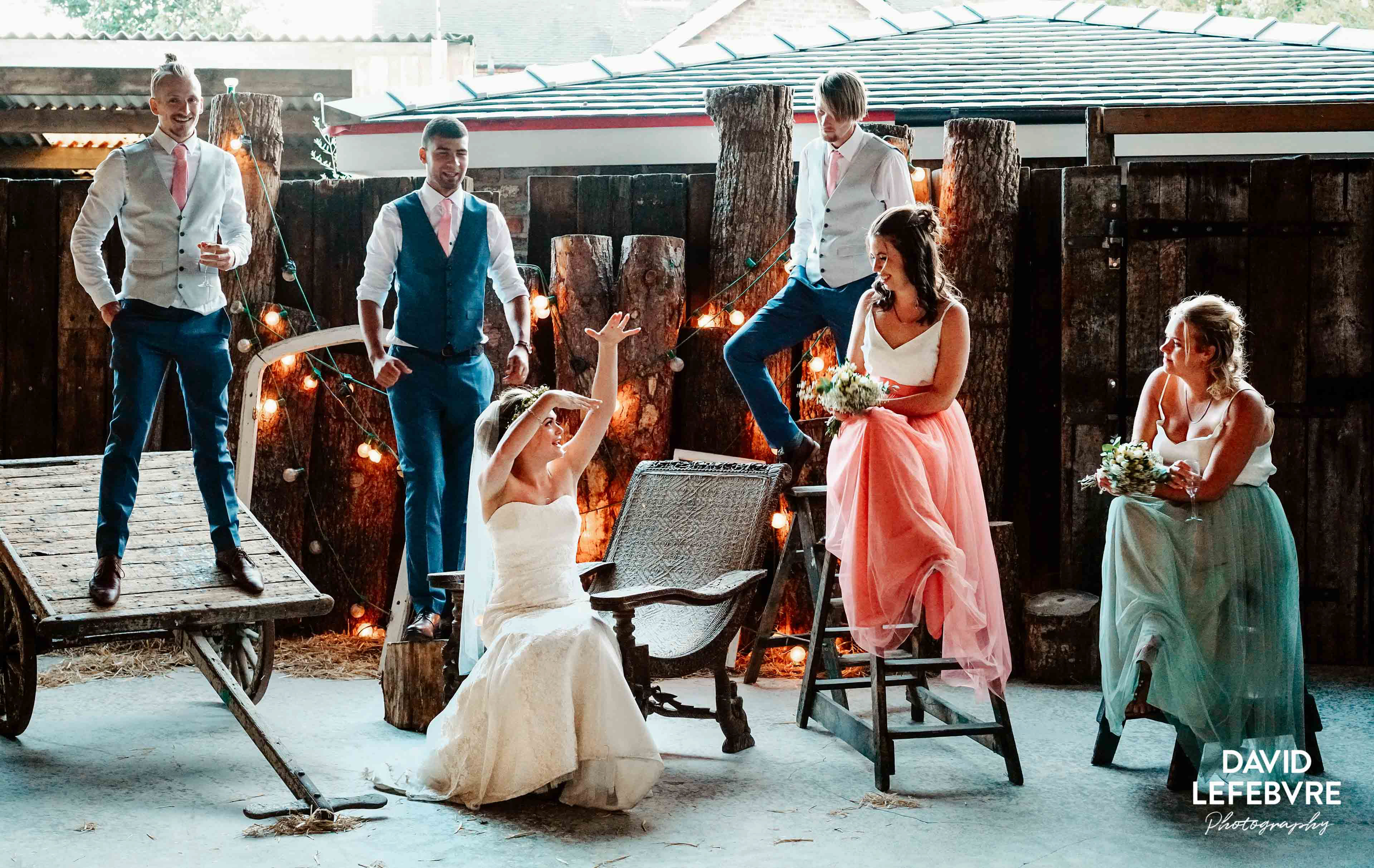 guys and girls arranging themselves for wedding photo at owen barn house