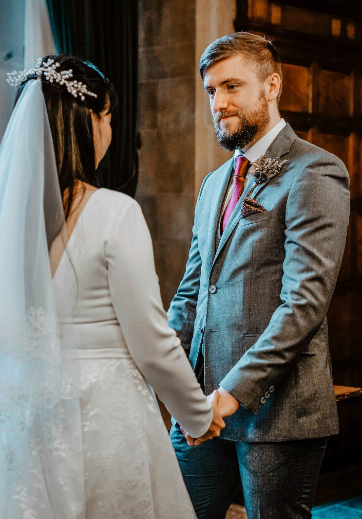 bride and groom look at each other in window at oxford town hall with buckinghamshire photographer david lefebvre