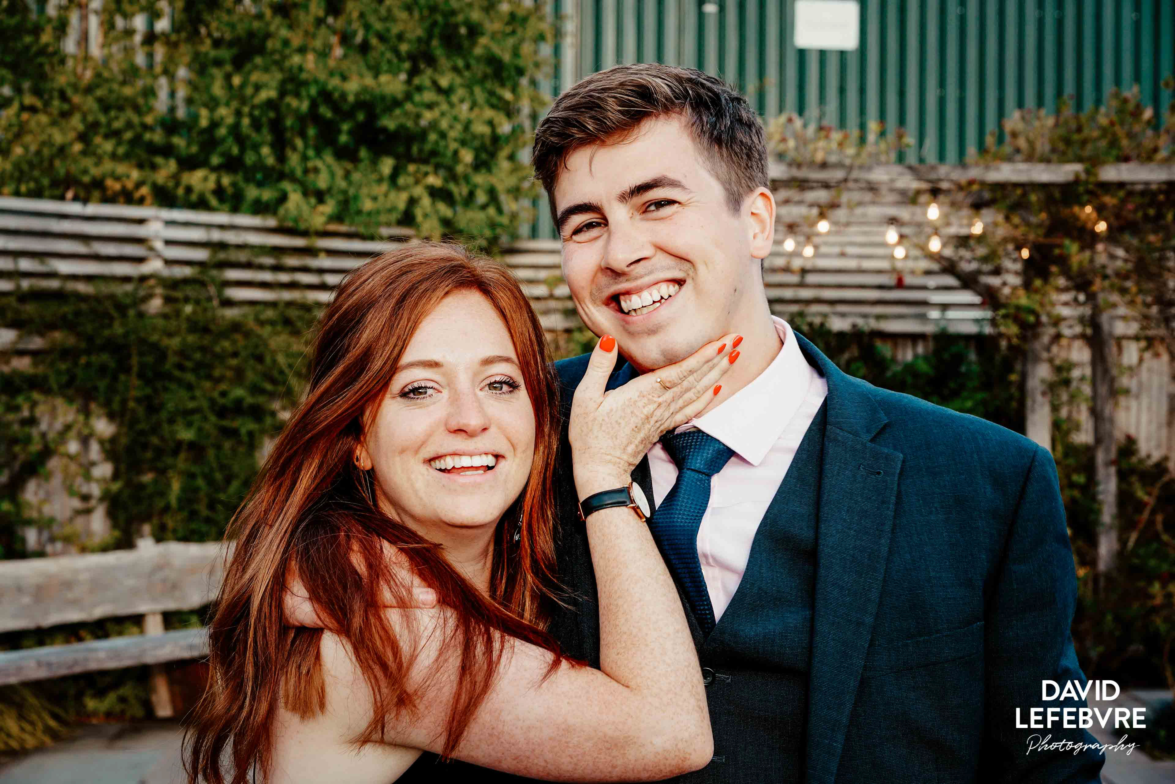 laughing wedding couple trying to smile for photo at owen barn house