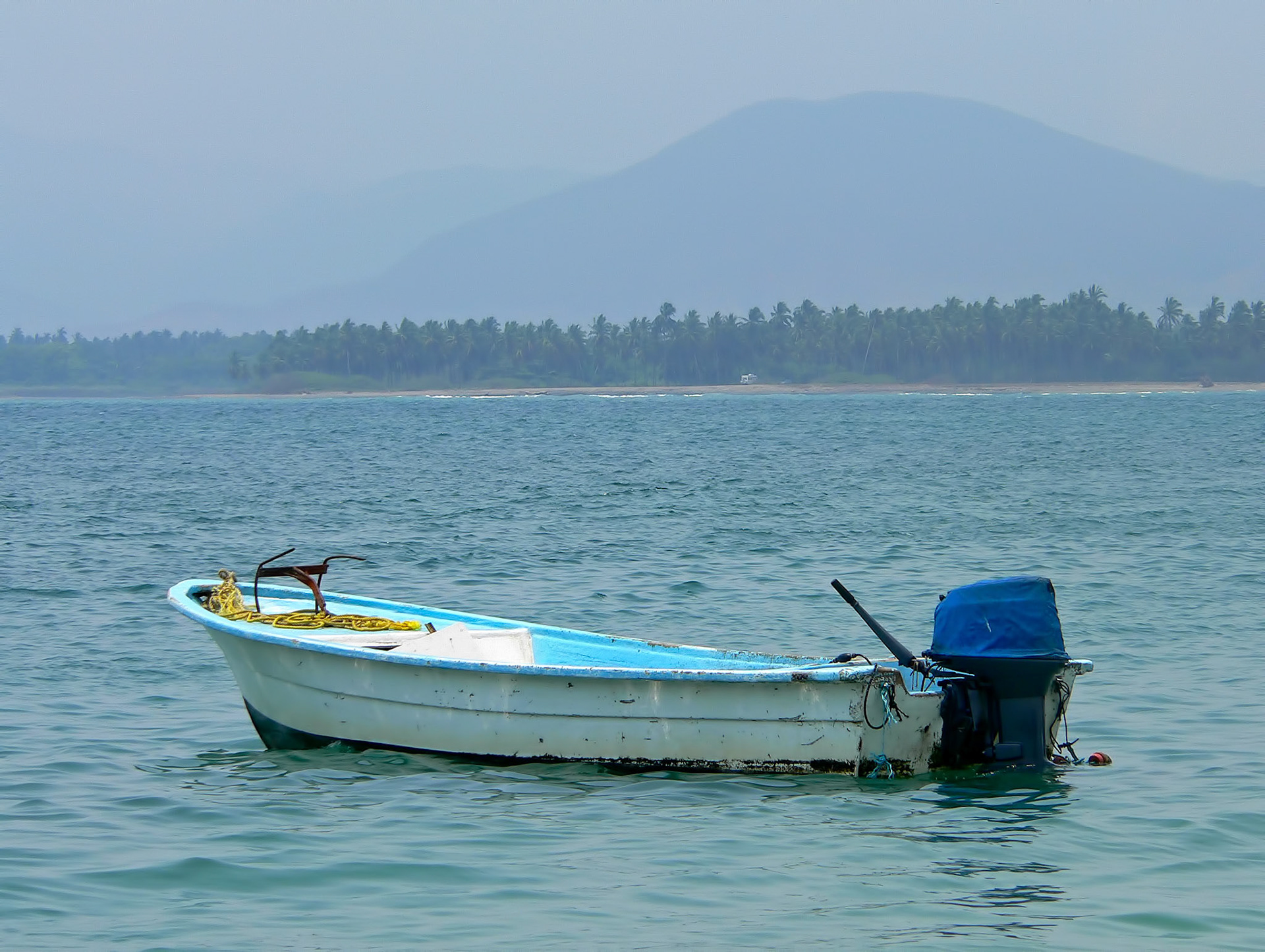 A boat anchored off Isla Ixtapa in Mexico near Playa Cuachalalate.