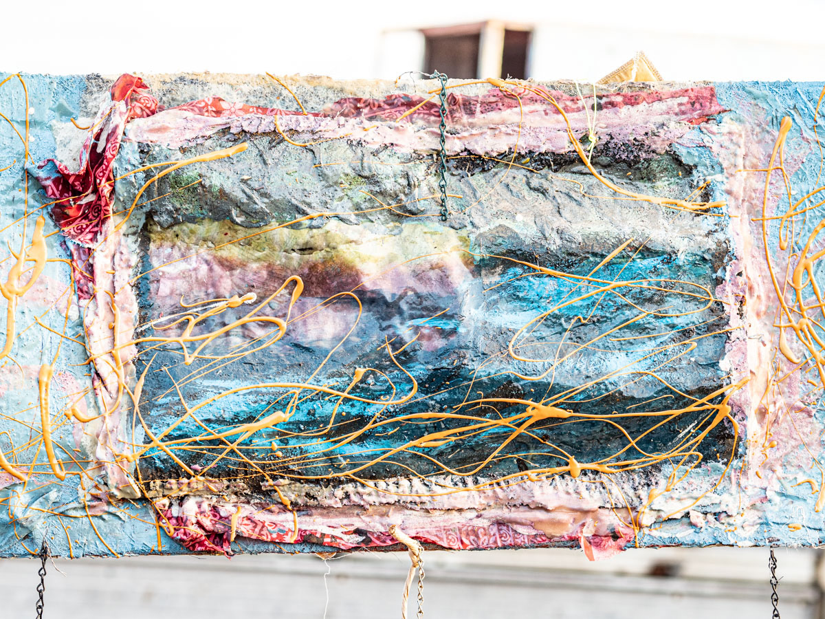 Side two of rice field with strings of resin