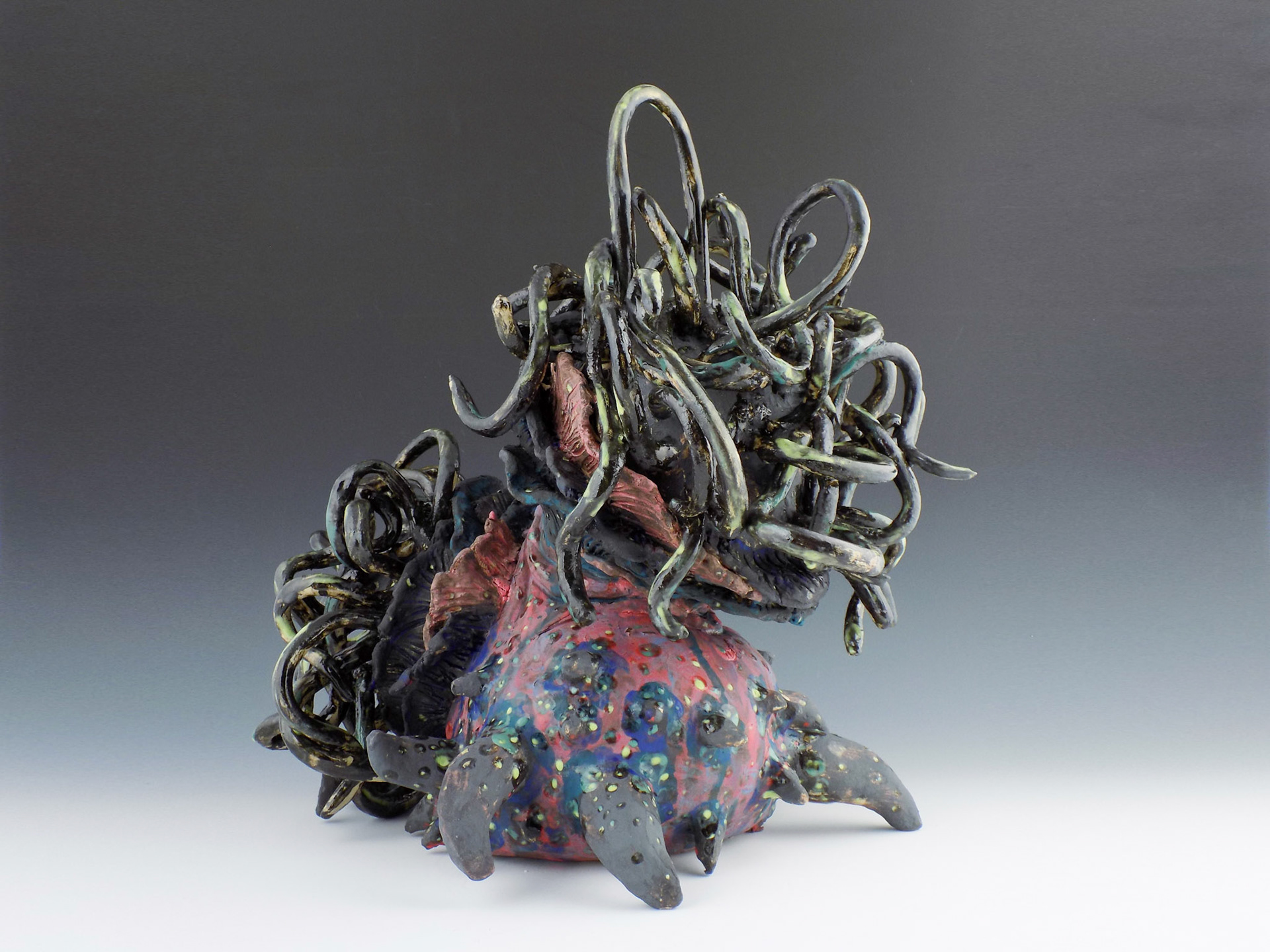The Vomiting Gorgon, 2019, ceramic stoneware, black iron oxide, underglazes, glaze, 16” x 17” x 14”