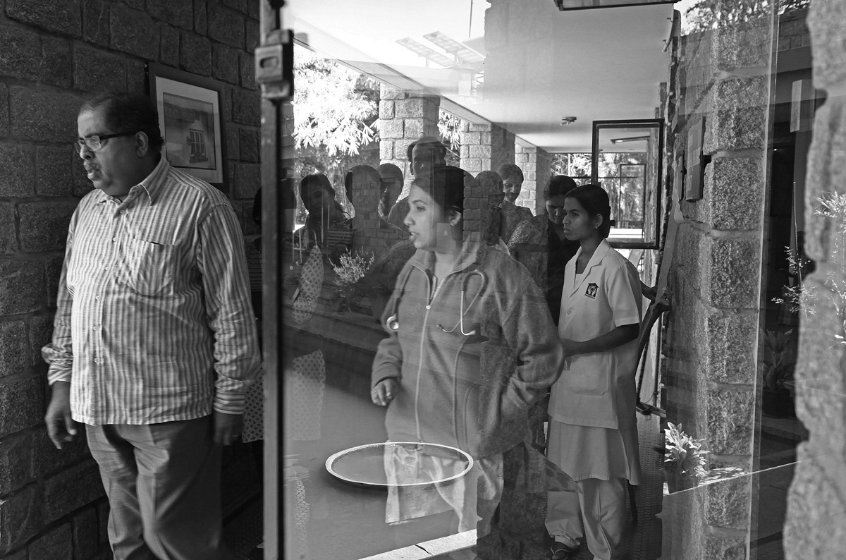 Dr. Nagesh Simha is the Medical Director at Karunashraya and President of the Indian Association for Palliative Care. He is a motivational speaker constantly in motion, offering anecdotes, humour and serious insight to everyone around him. Here, he leads and instructs a team on daily rounds.