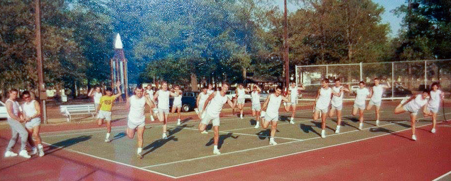 For our weekly Physical Training sessions, we had a full set of exercises that we were required to complete. Shown here, we added a bent arm and a hooked wrist to our mandatory quad stretch to represent our class mascot, the pink flamingo. On this particular day, Doley and Kenny (left) just flexed for the camera while the rest of us exercised.
