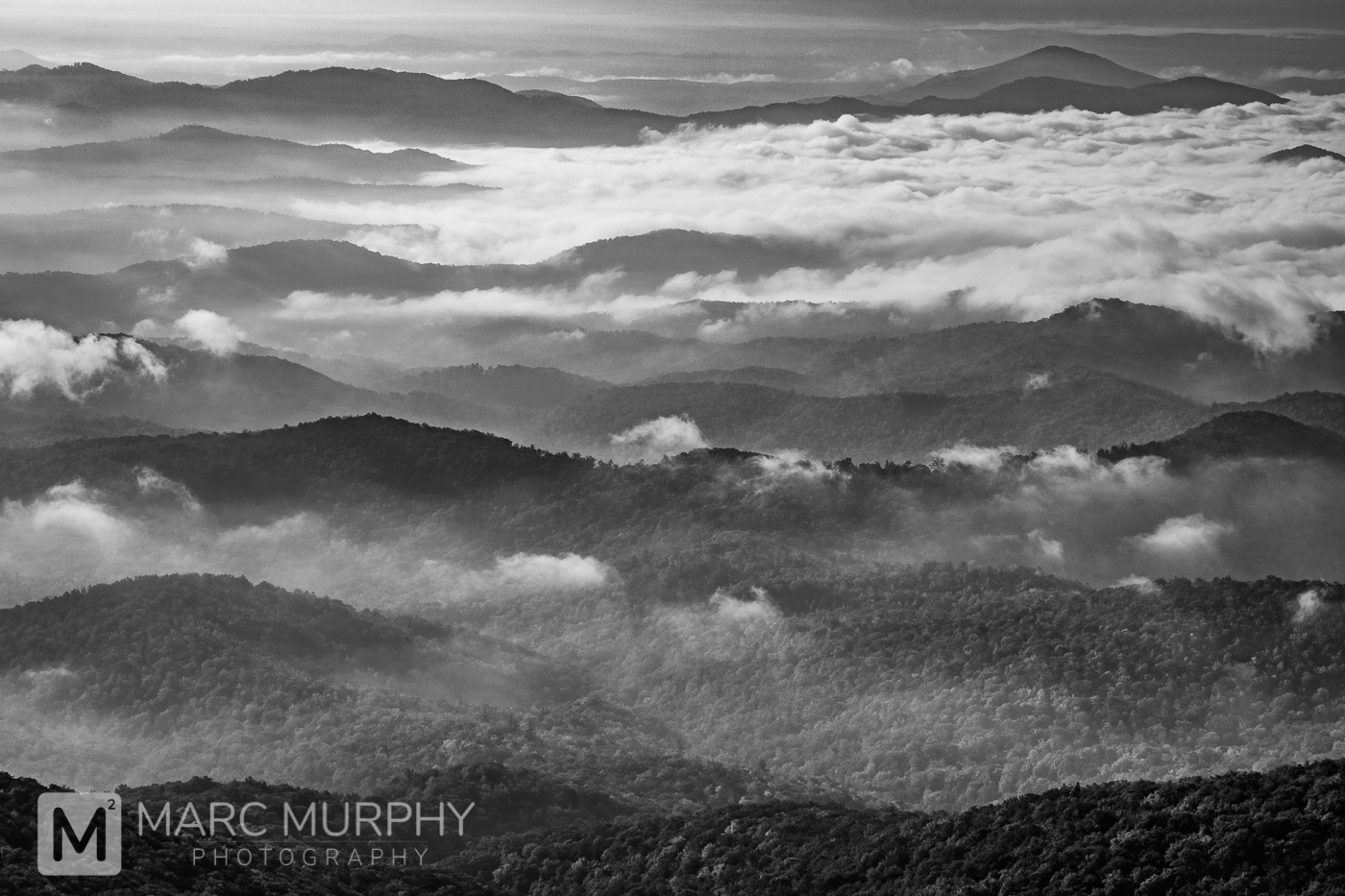 Black and White Western North Carolina Mountains with Clouds and Fog Rolling Over the Mountain Tops