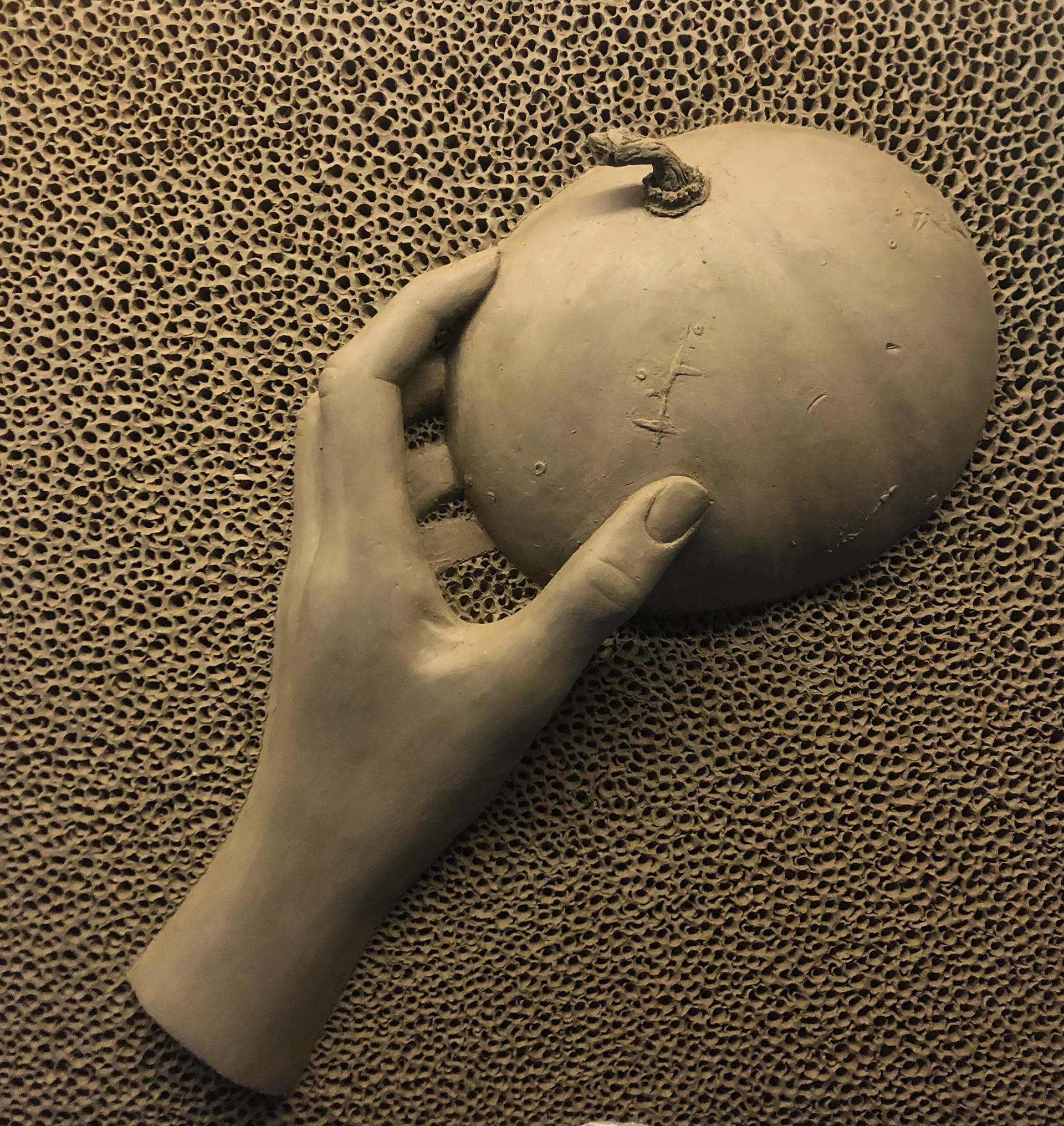 Alessia Piatti, Grade 12, Central Noble Jr Senior High School. hand and pumpkin, Sculpture. Abbey Mault, Educator.