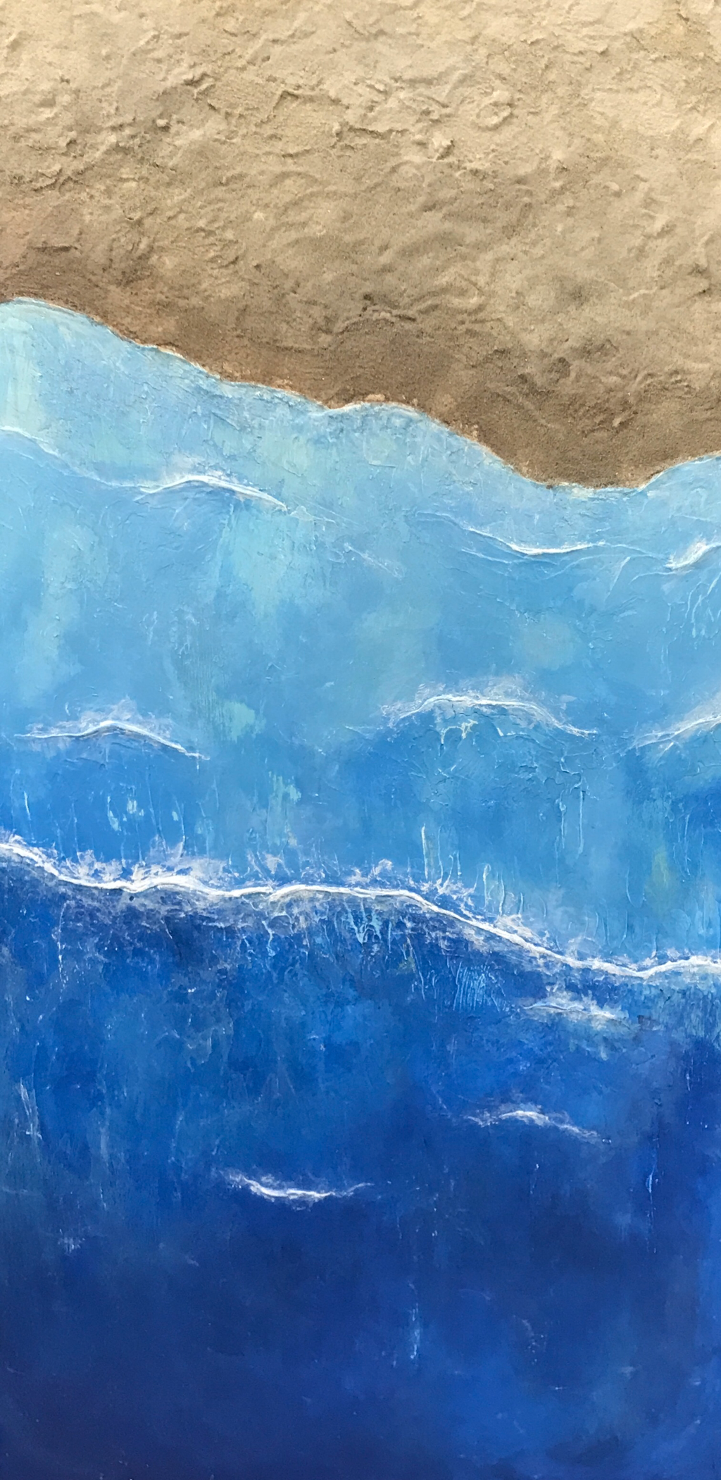 "Beach Wave" | 12" x 24" | Acrylic, gesso, modeling paste, and sand on wood | I did an aerial view of waves crashing onto a beach. I used modeling paste to get textures in the water and to make the waves. I also used real sand for the beach. There’s more sand in certain areas which shows movement.