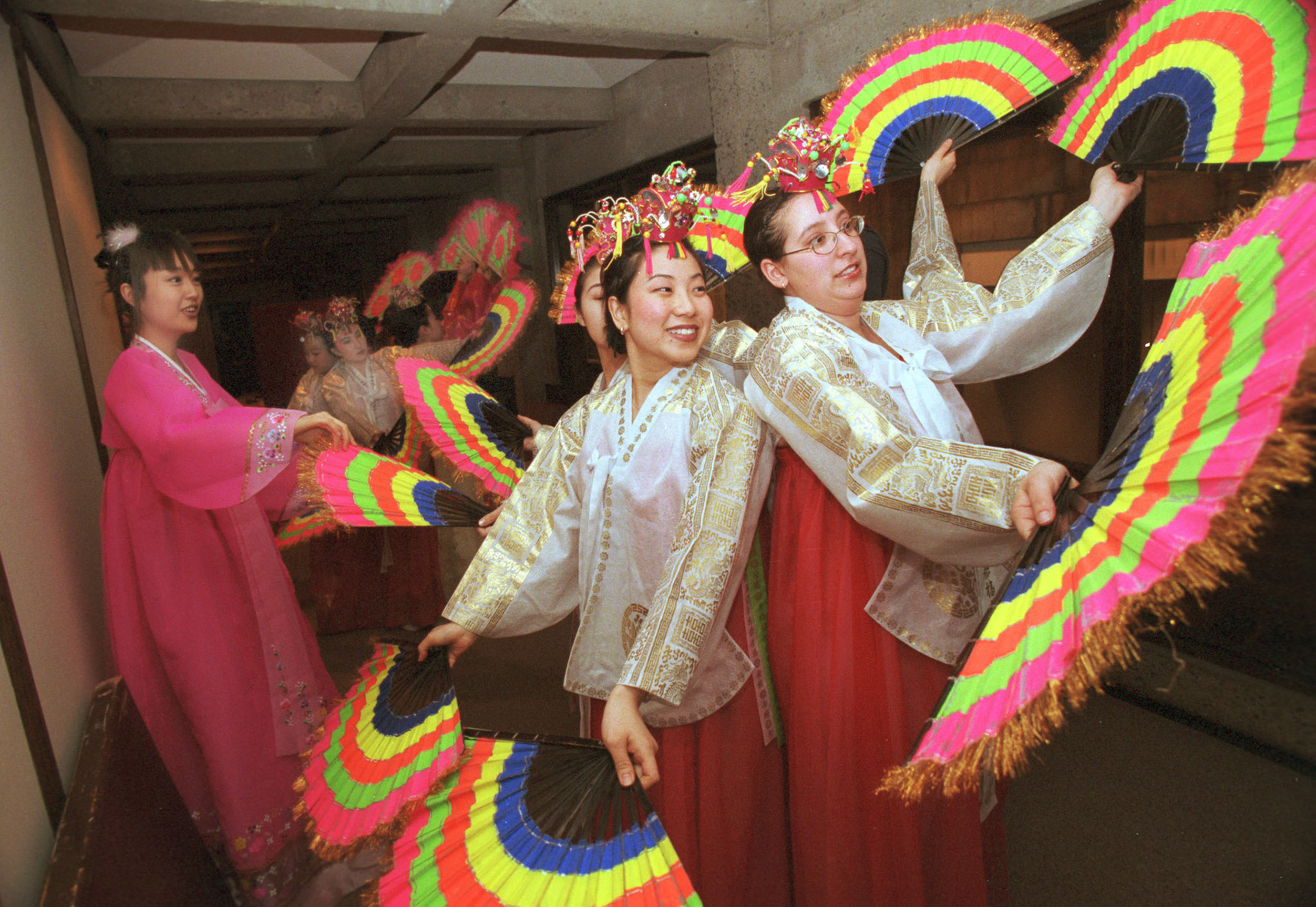 A fan-dancing troupe gets set to take the stage at the “Korean Night 2000” gala. February 2000.