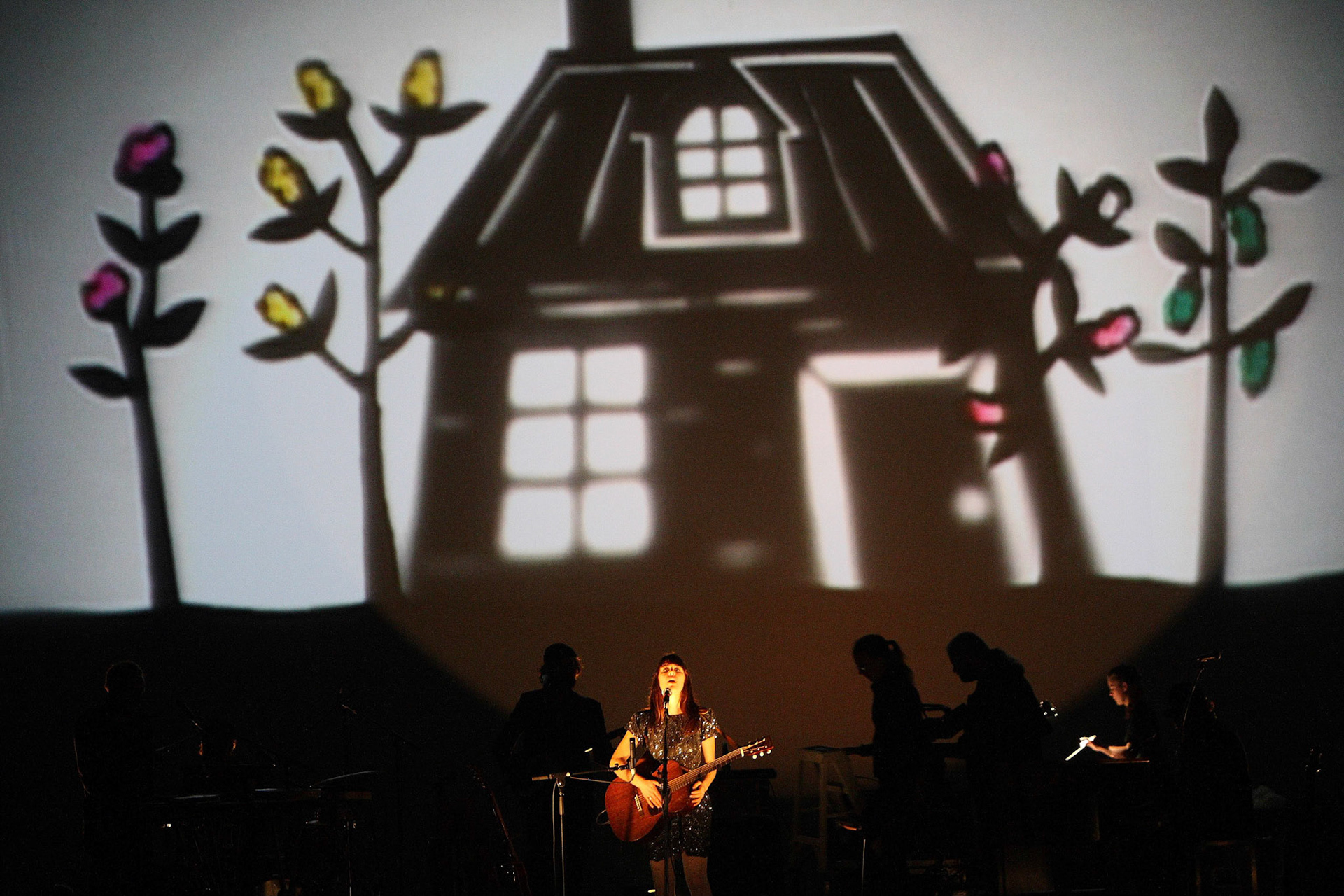 Feist performs at the Bell Centre in front of the projected puppetry by McGill grad Clea Minaker (BA '02). November 2008.