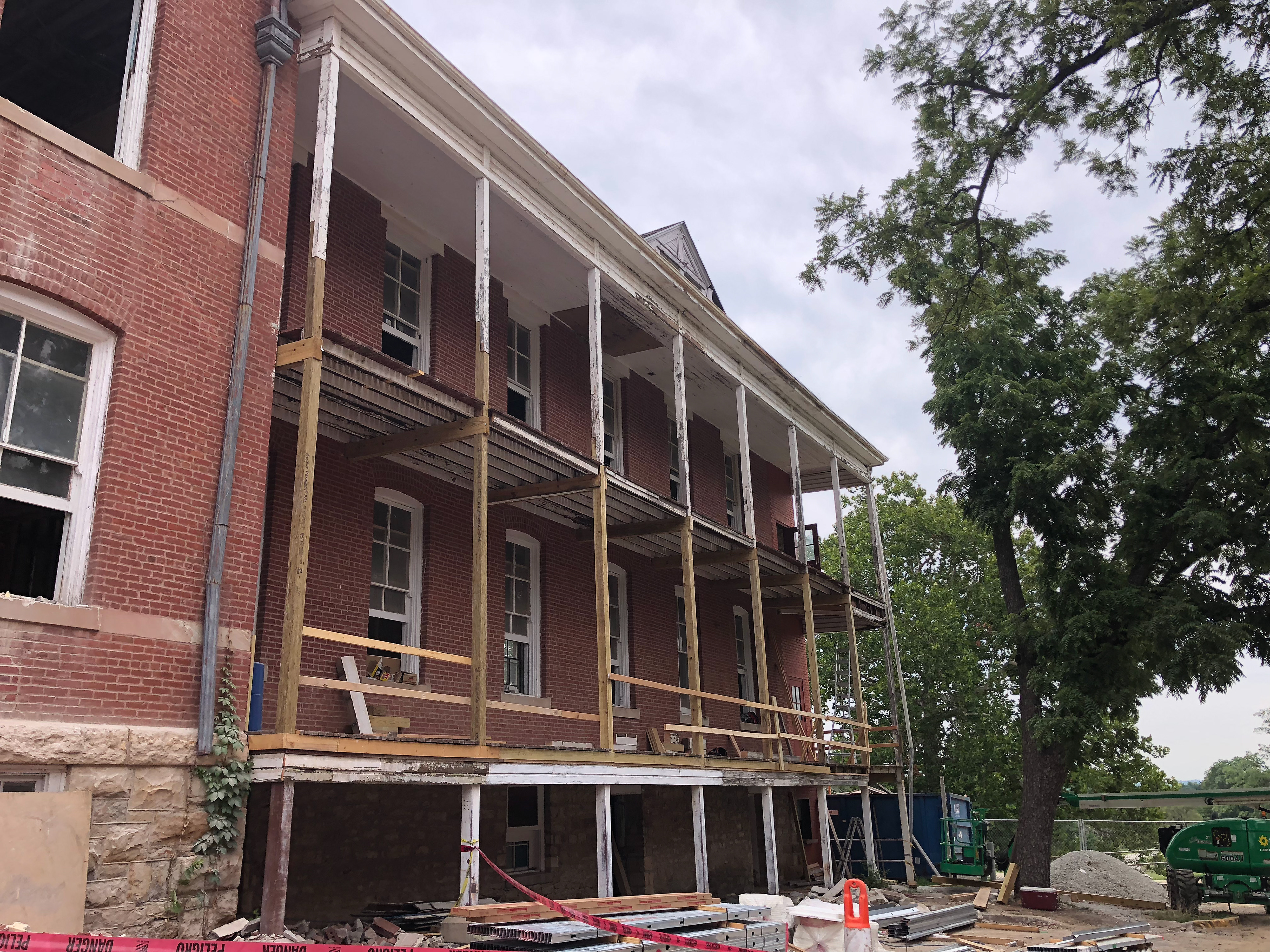 Wood porch repairs in progress.