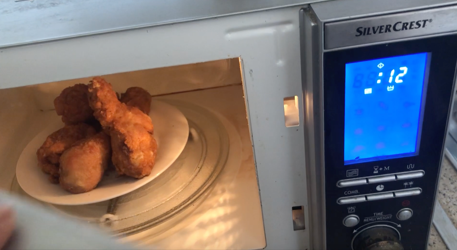 King Divine Fried Chicken Being Microwaved