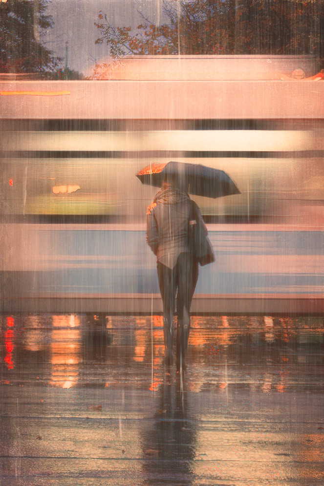 Lady Waiting From the rainy night series. Lady waiting for the bus to pass and the light to turn so she can be on her way home.