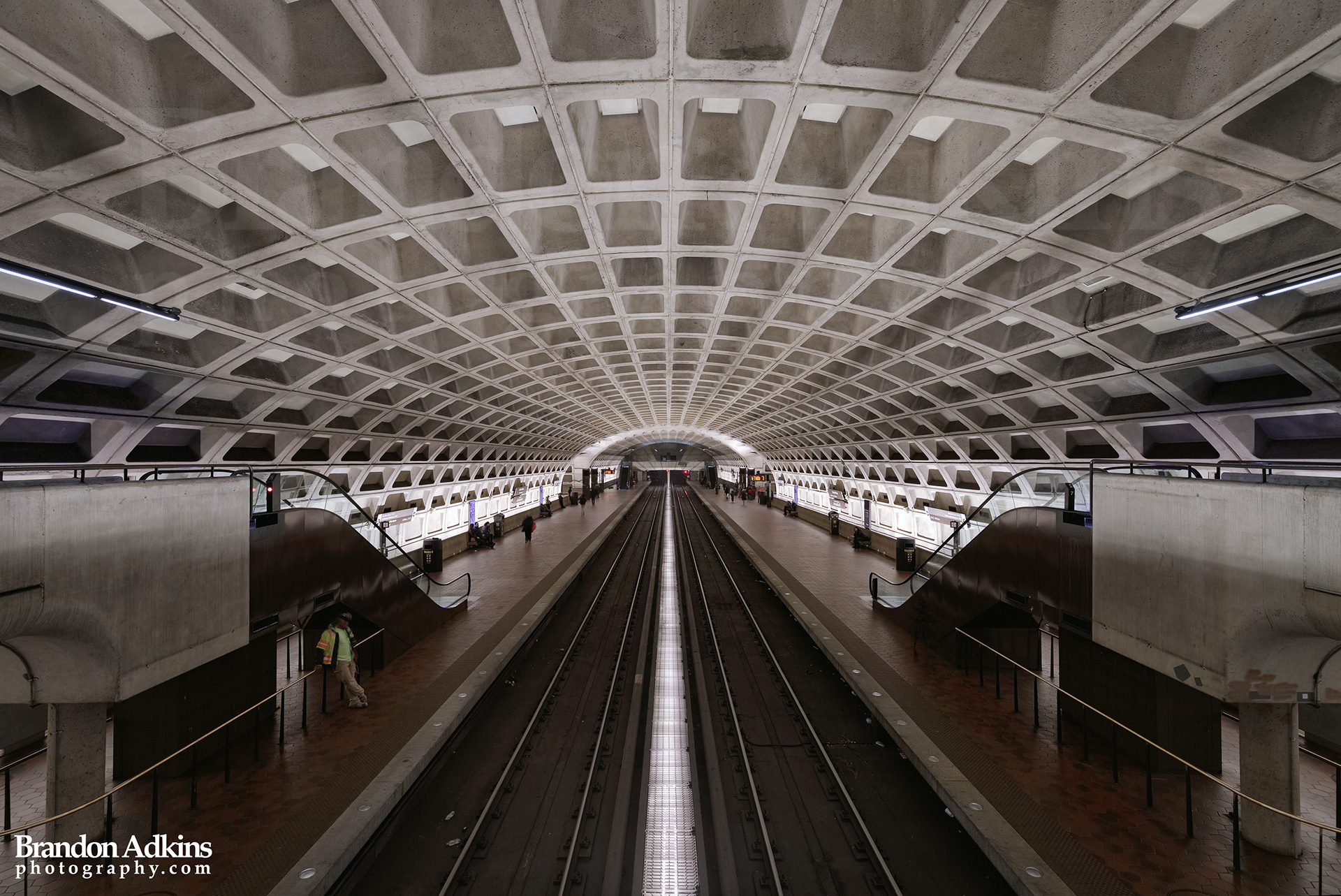 Fine art photograph of metro underground subway station with waffle vaulted ceiling and brutalist design in Washington, DC