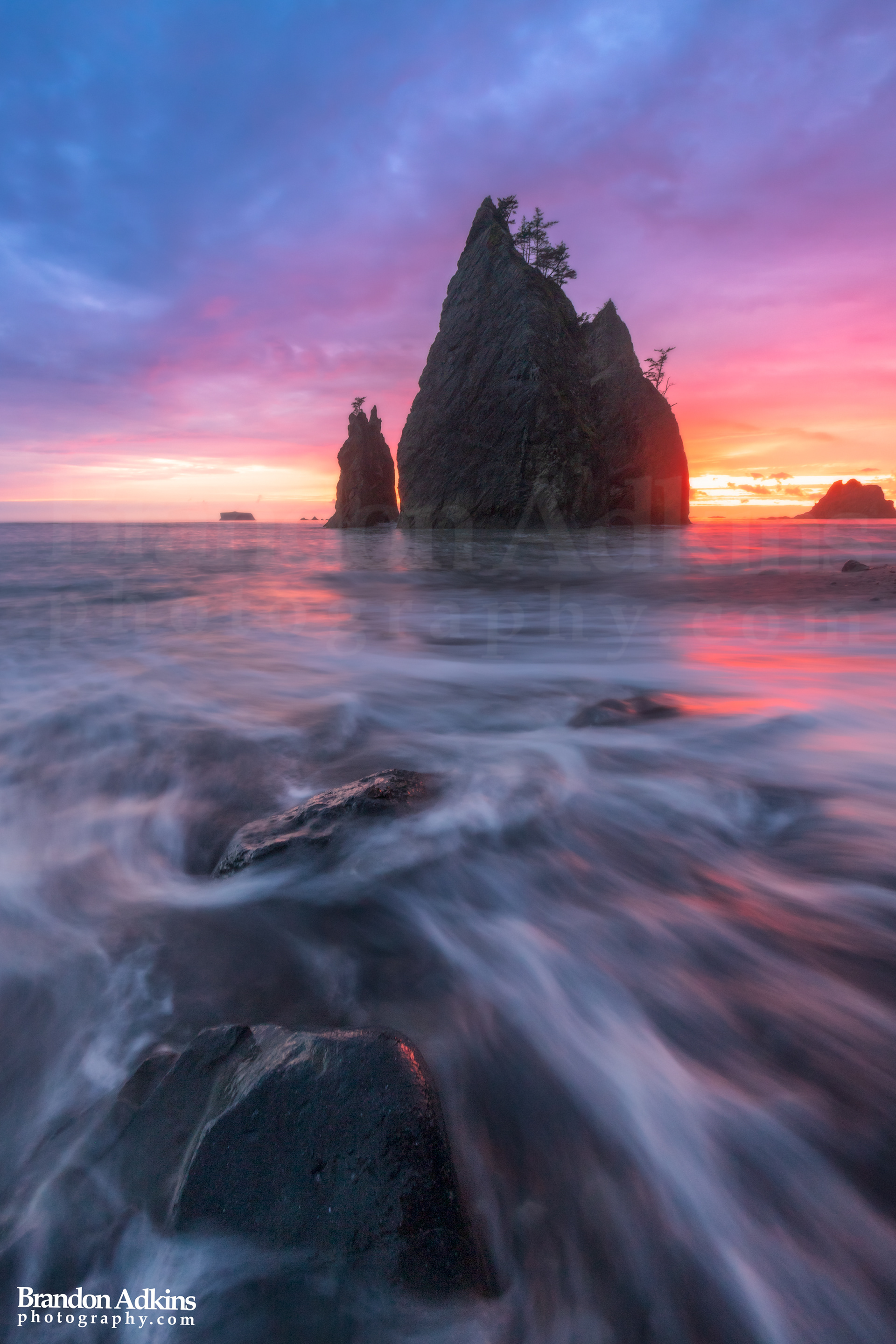Fine art photograph of rushing water and sea stacks at RIalto Beach, Olympic National Park