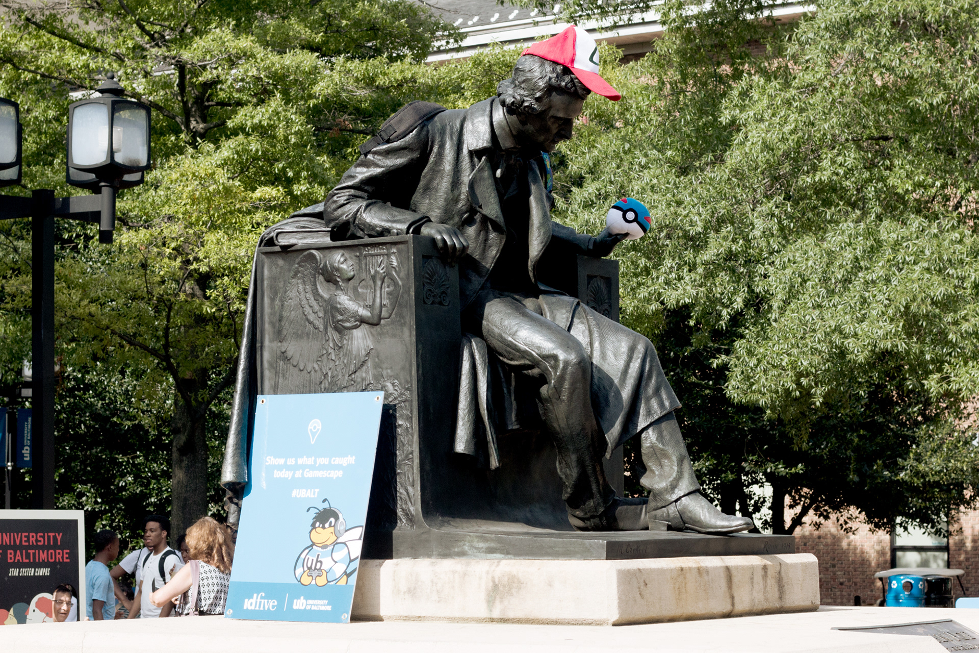 Emilee Beeson Gamescape social media PokemonGo stunt with Poe statue on UB campus.