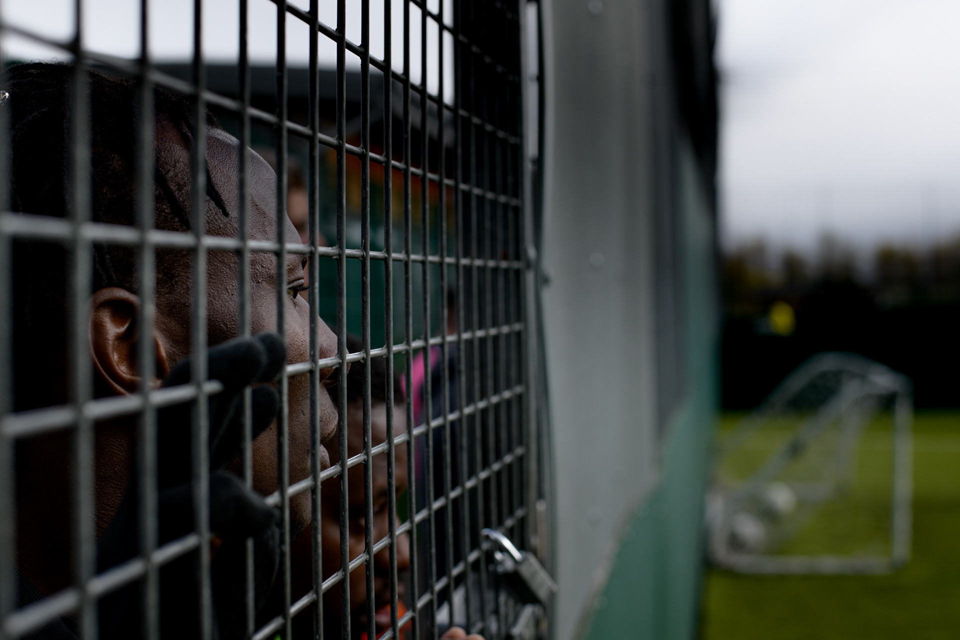 William watches his team training at a Street Football Wales match day whilst waiting to be called on to the pitch at the Gol Centre, Cardiff, UK , 3rd April 2019. Homeless, socially excluded and asylum seekers often face barriers and can feel locked out of mainstream society.