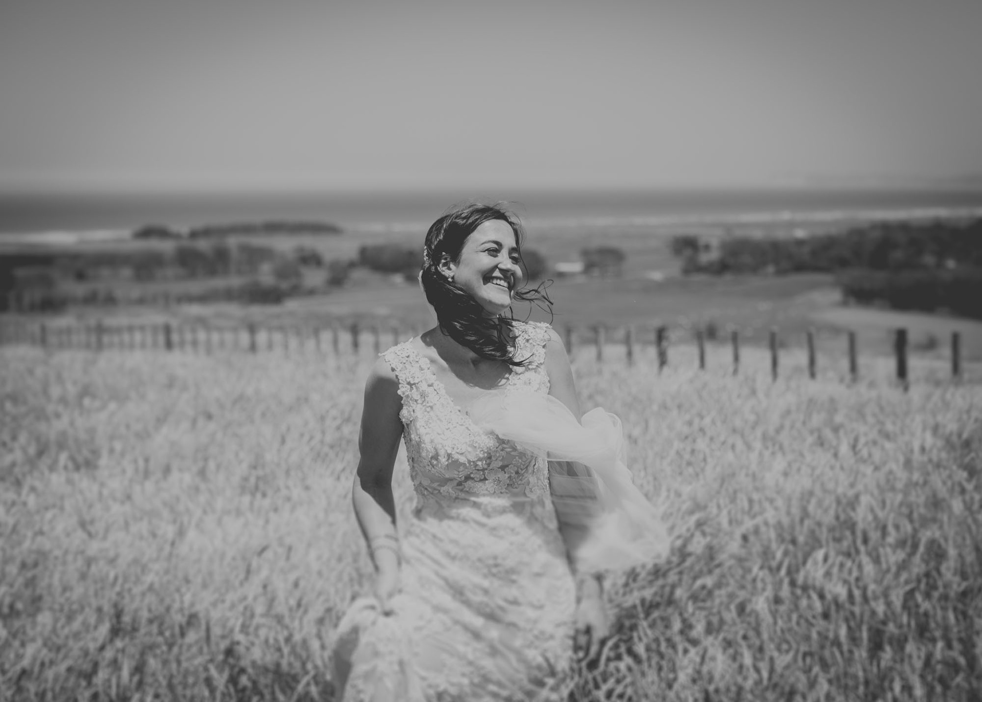 Bride Jenelle smiling and laughing on the family farm