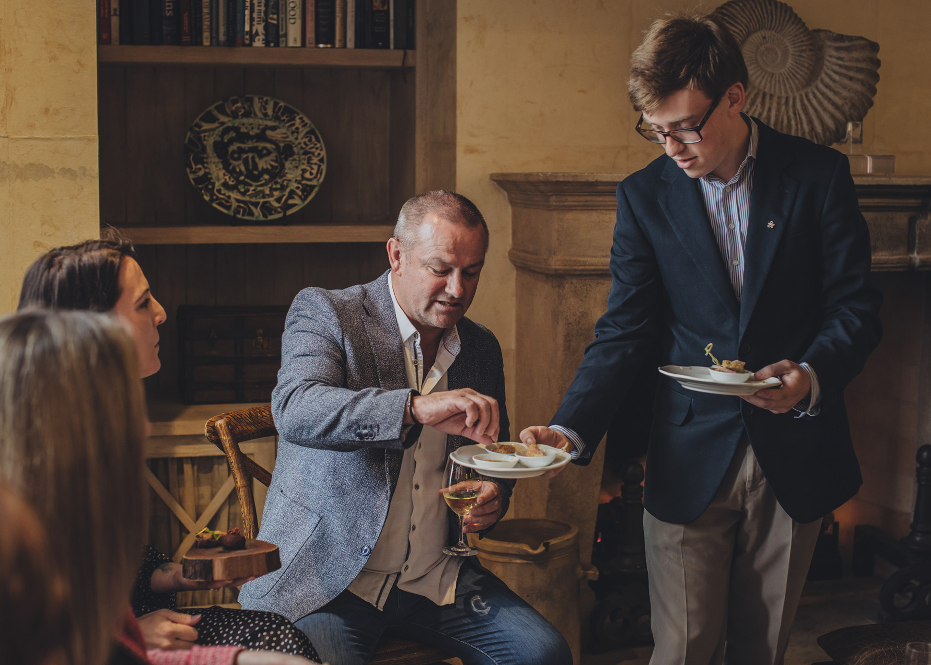 Guests enjoy canapes before dinner is served at The Farm Cape Kidnappers