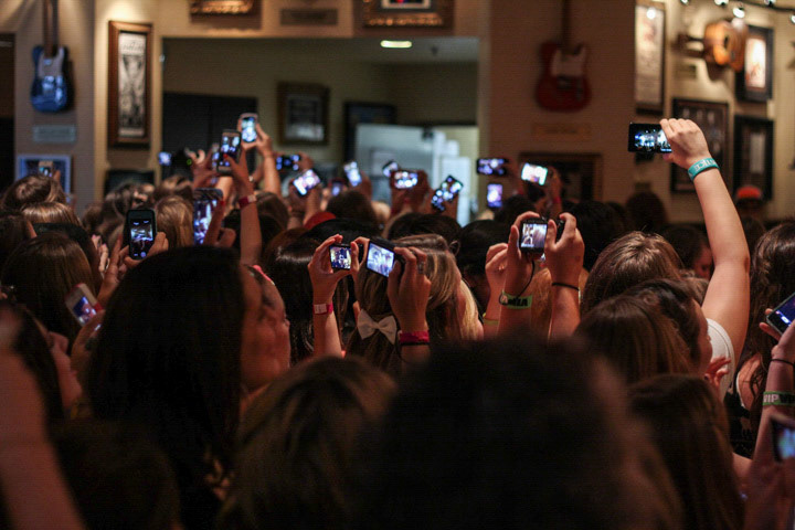 Fans taking photos of emblem3 at the Hard Rock.