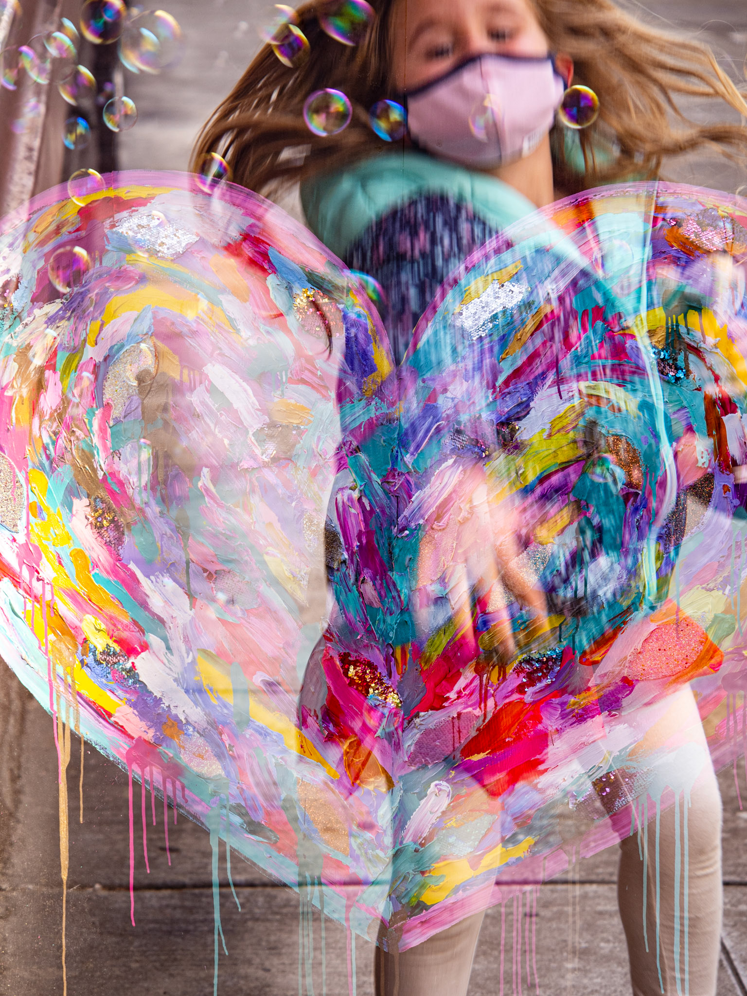 'Spring in Midwinter', 1/29/21. Girl chasing bubbles. Heart on plywood by Kate Tovah.