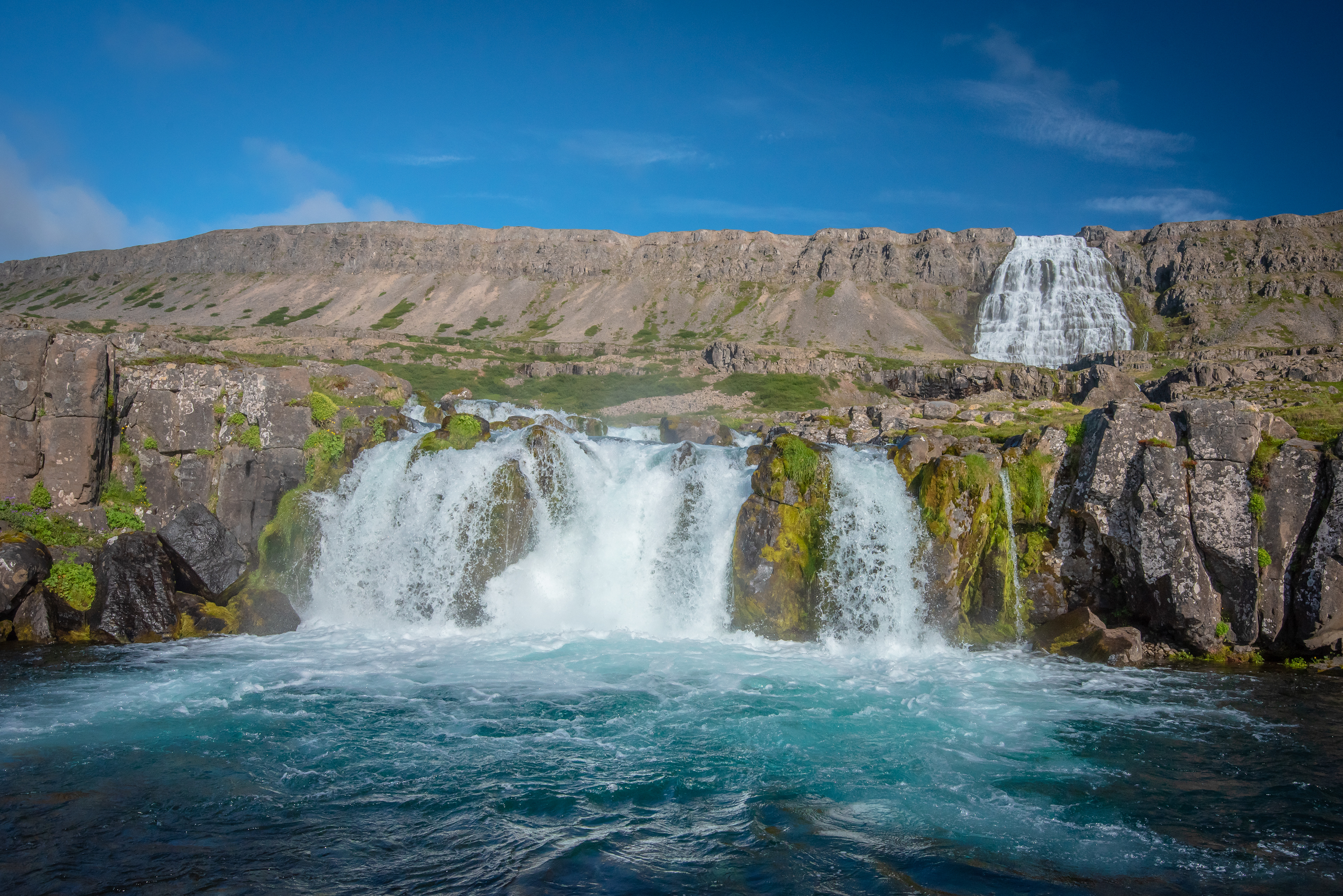 Near the parking lot, by Dynjandi waterfall, you will meet the first of many waterfalls on the hiking track up to Dynjandi.