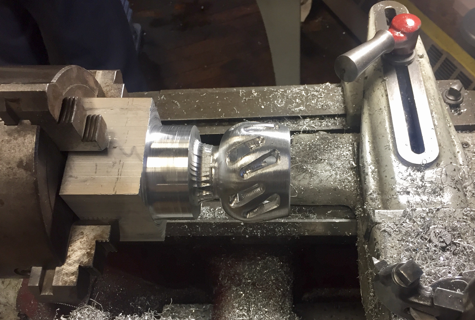 Finished on lathe by boring a 10° beveled hole, filing and parting.