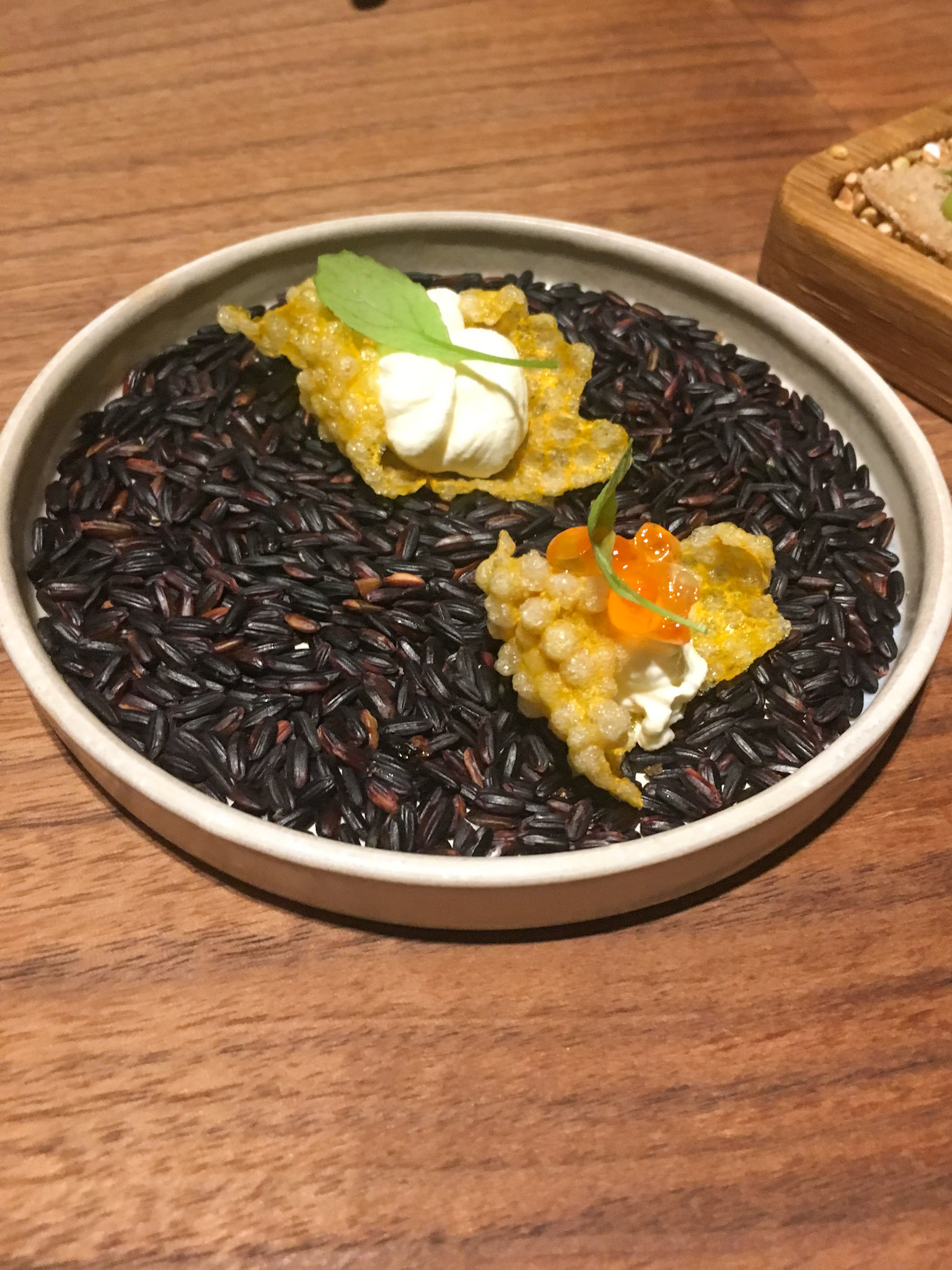 Amuse-Bouches served in white ceramic bowl filled with black rice - Costes Downtown Restaurant - Budapest