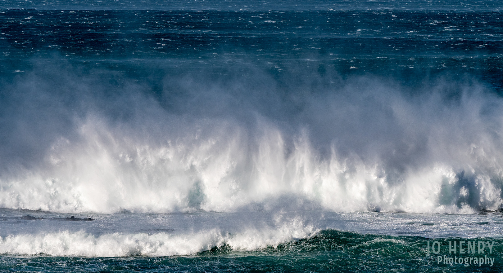 Wave Crashing onto Shore