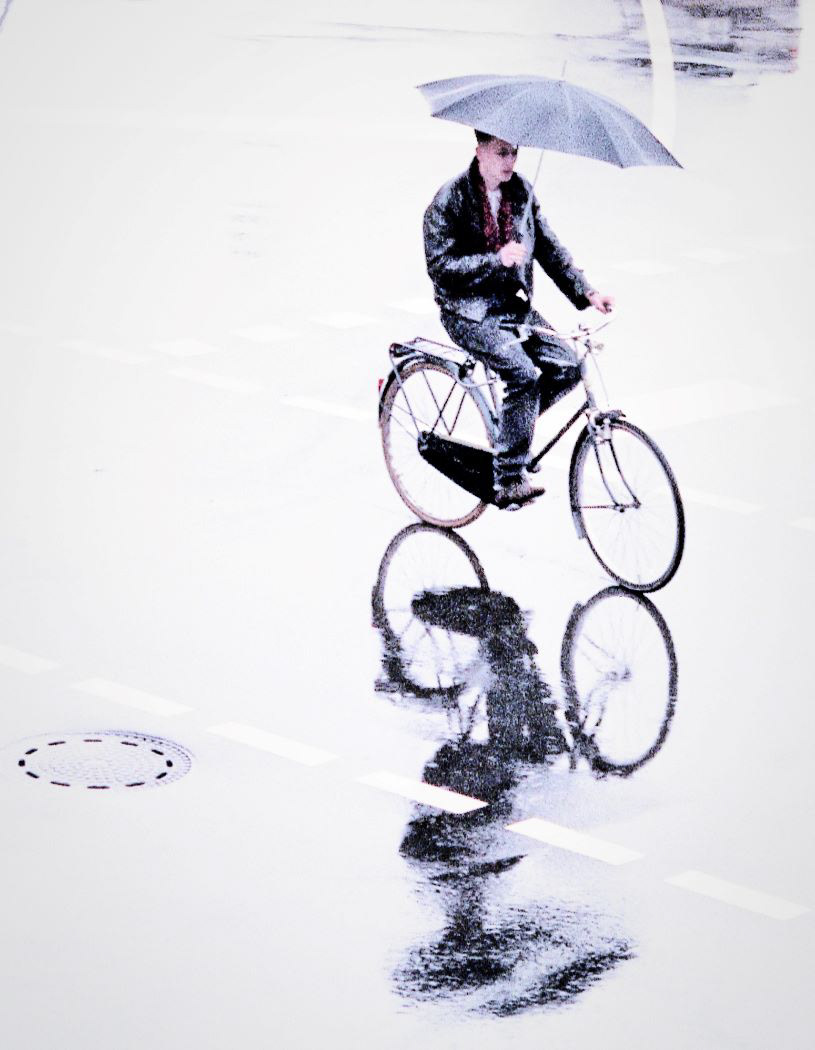 Bike Rider with Umbrella