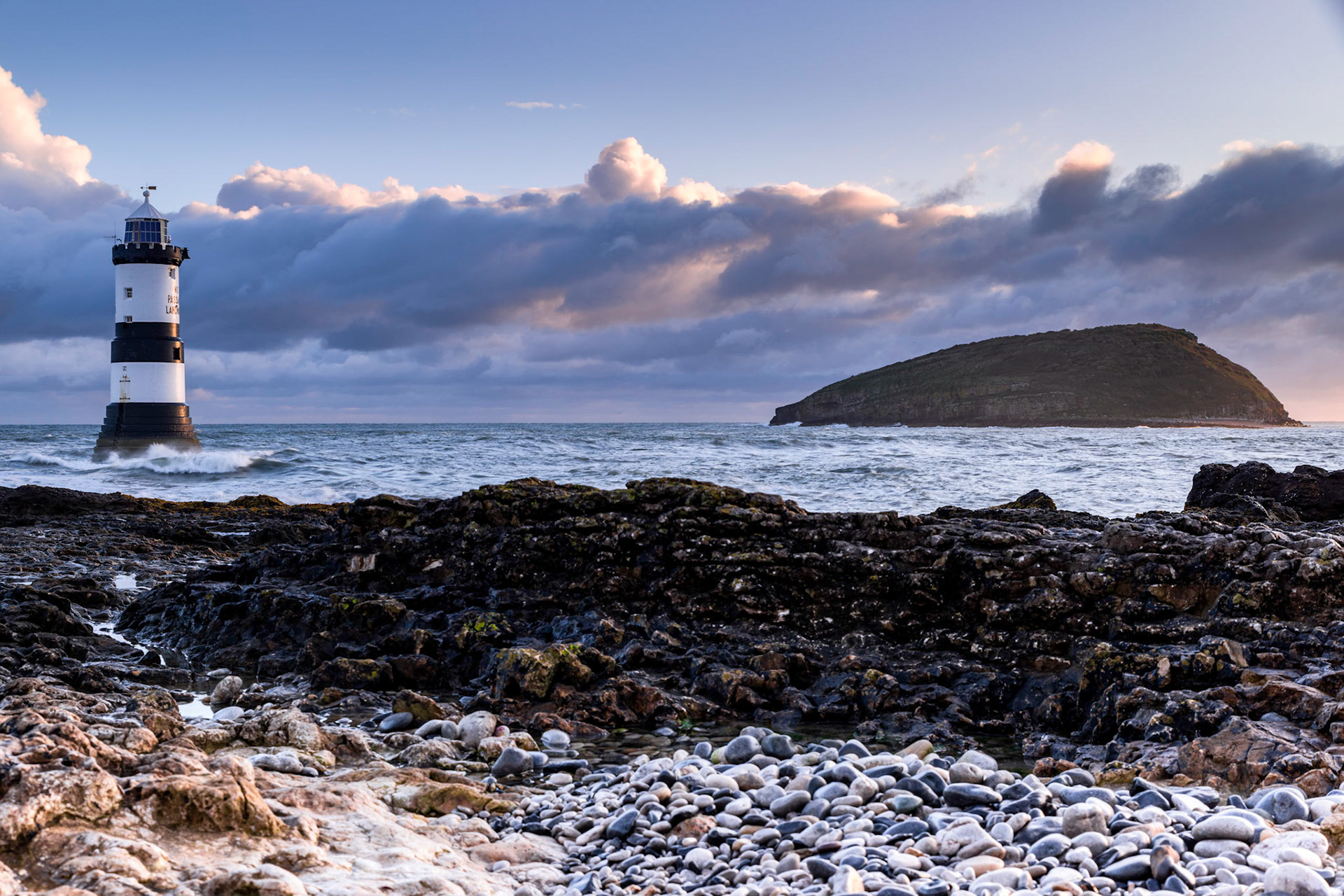 Sunrise at Penmon Lighthouse (Trwyn Du Lighthouse), Penmon, Isle of Anglesey, North Wales, UK