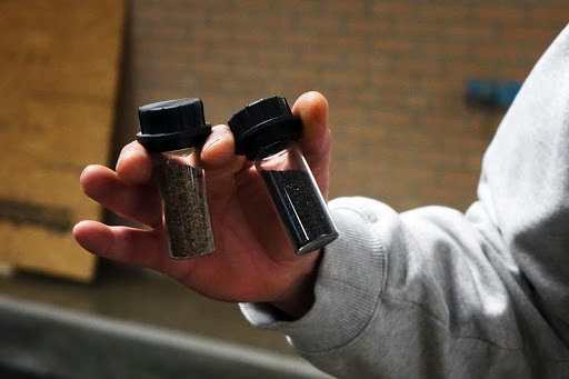 Matt Everts, the Moberly water plant chief operator, displays the different types of sand which water filters through on Wednesday, March 6, 2019. Moberly used a Missouri Department of Natural Resources State Revolving Fund subsidized loan to pay for the water treatment plants upgrades. This raised customers utility rates to help pay off the loan. This sand filter is one of the finishing steps for water before it is distributed to customers through the city’s water mains.