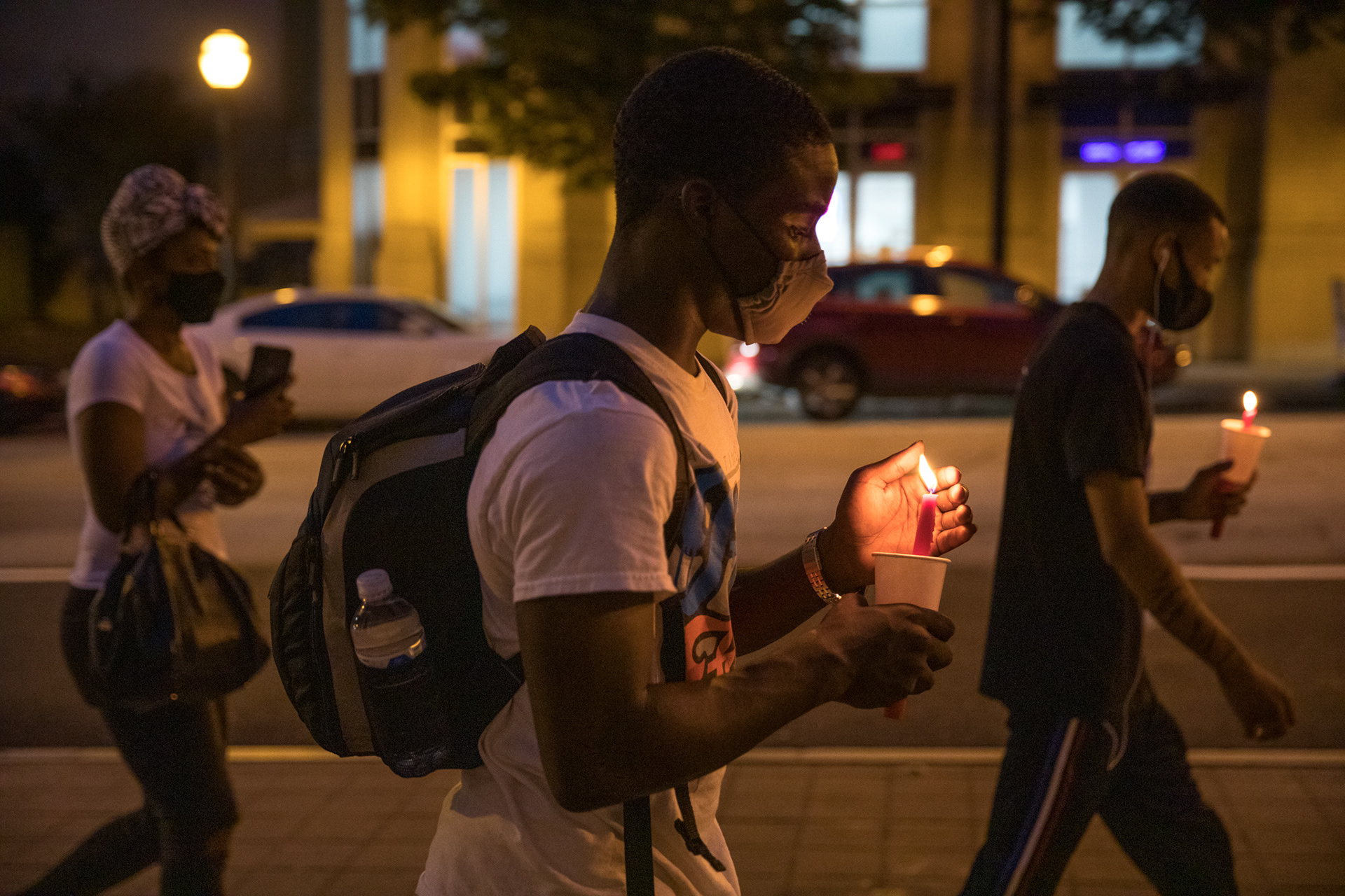 Family of loved ones lost to COVID-19 march from National Center for Civil and Human Rights in downtown Atlanta to the Georgia State Capitol building during a vigil Aug. 27.