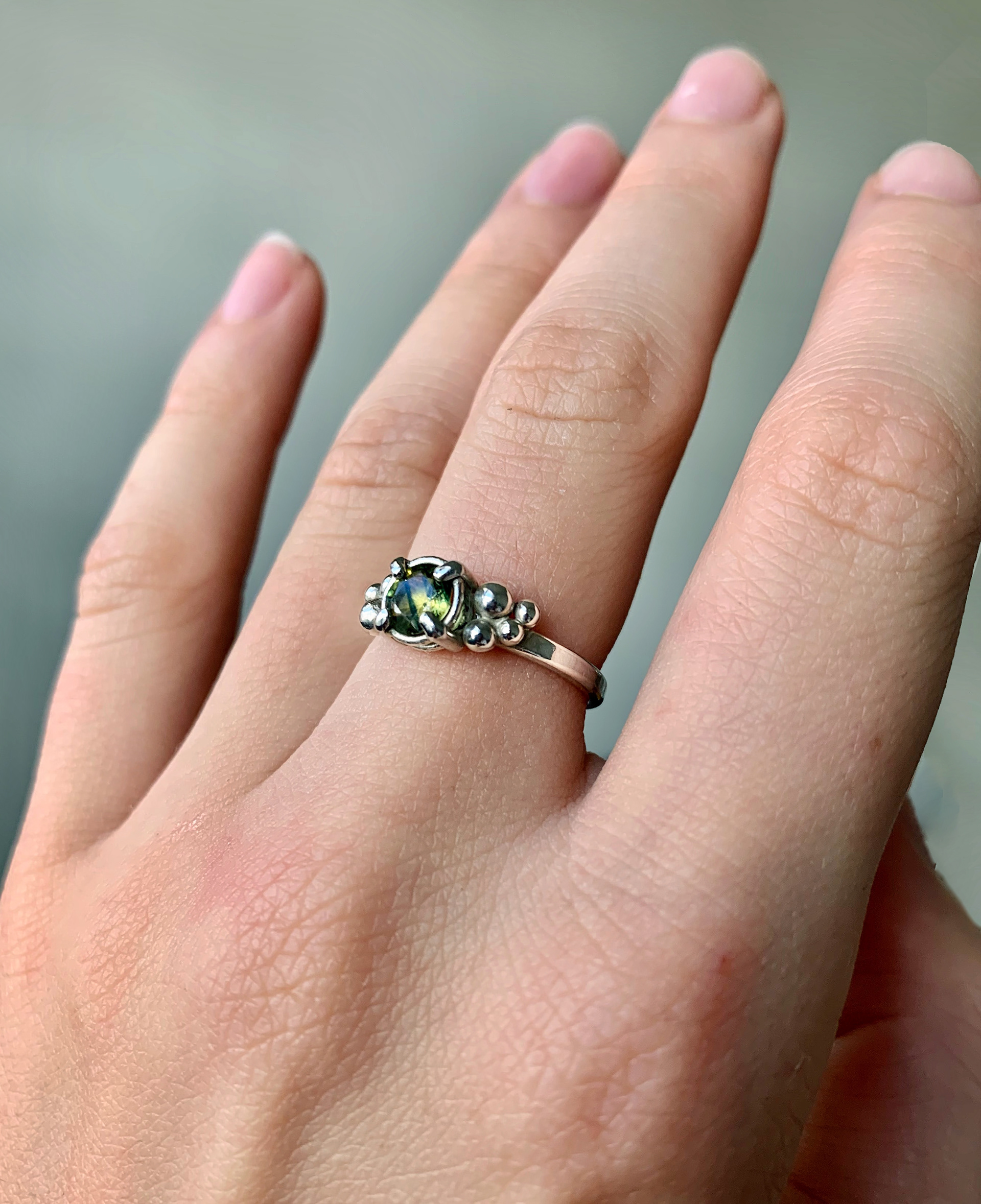 prong-set green sapphire ring with granulation