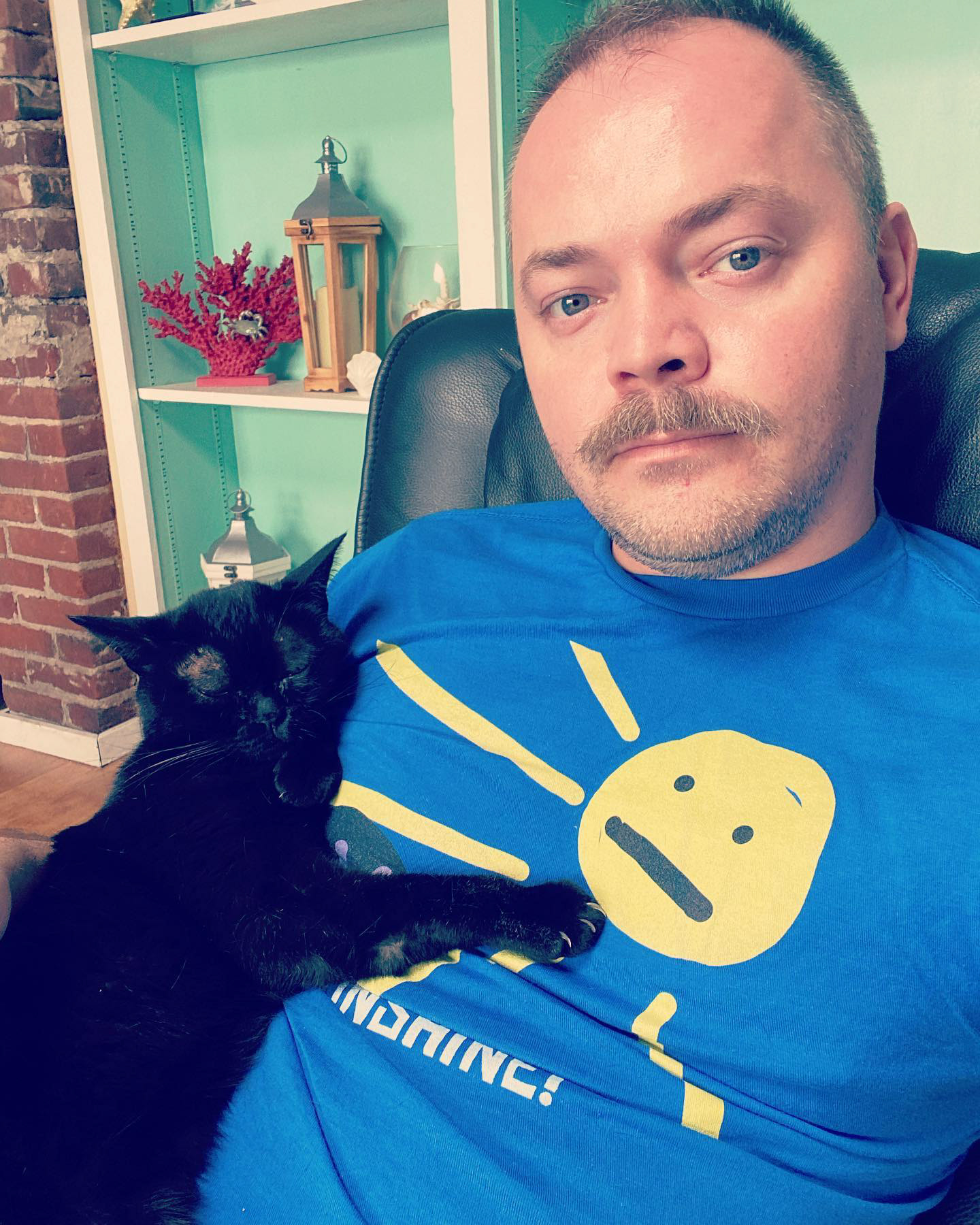 Adam with a black cat