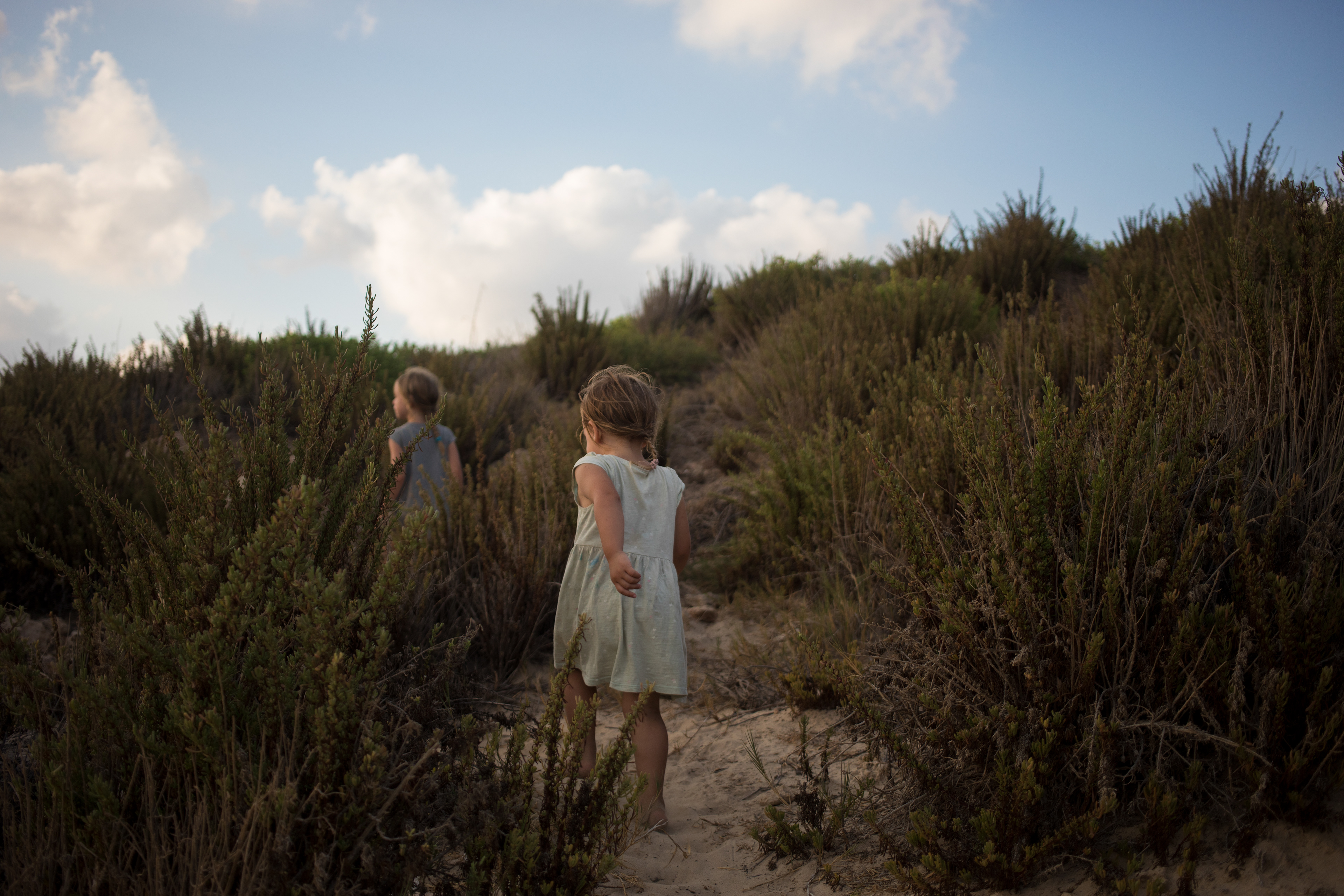 Two girls run through the beach in Habonim Israel on August 9,2019