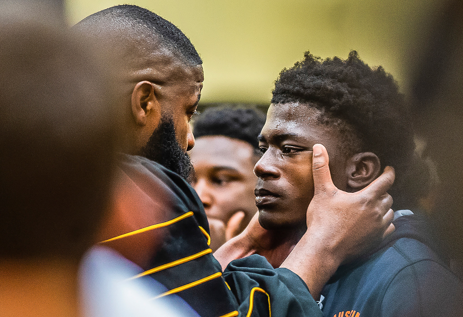 DT Shackelford, left, wipes away tears from Austin student Kerri Minor Jr. during Impact Day, held by Decatur Youth Services on Thursday, May 2, 2019, in Decatur, Ala. The former Austin and Ole Miss football star, Shackelford, spoke with close to 100 at-risk students from Decatur City Schools during the event.