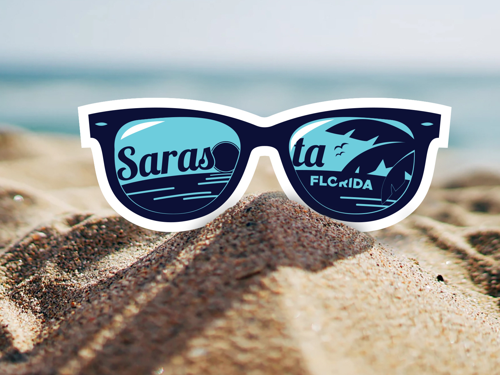Diecut sticker in the shape of sunglasses with a Sarasota, FL beach scene illustration in the reflection 