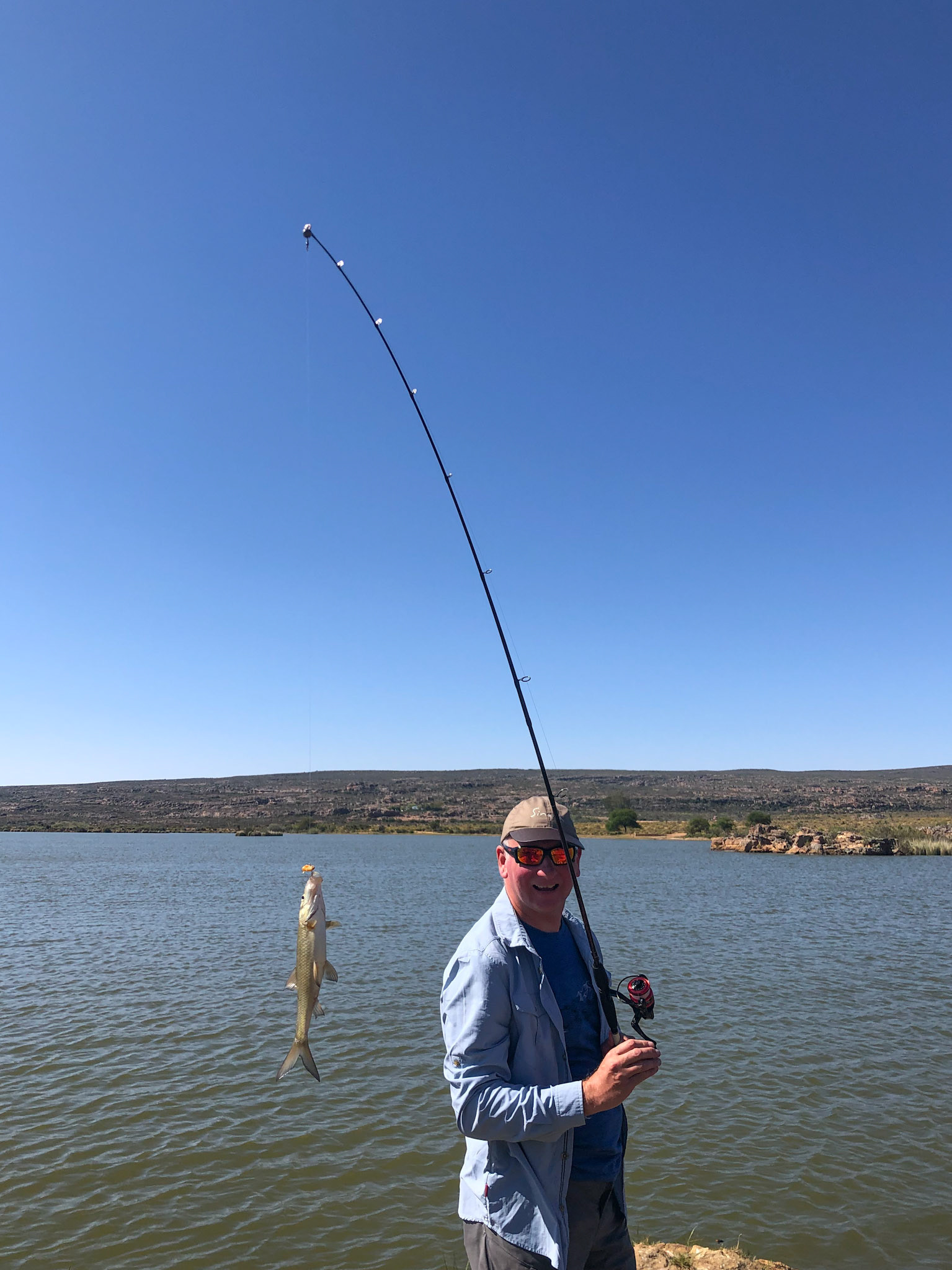 Fishing at the Main dam, Bushmans Kloof