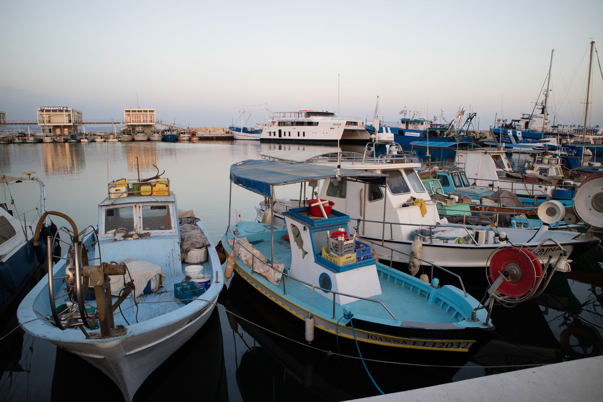 Fishing boats in Limassol harbour at dusk