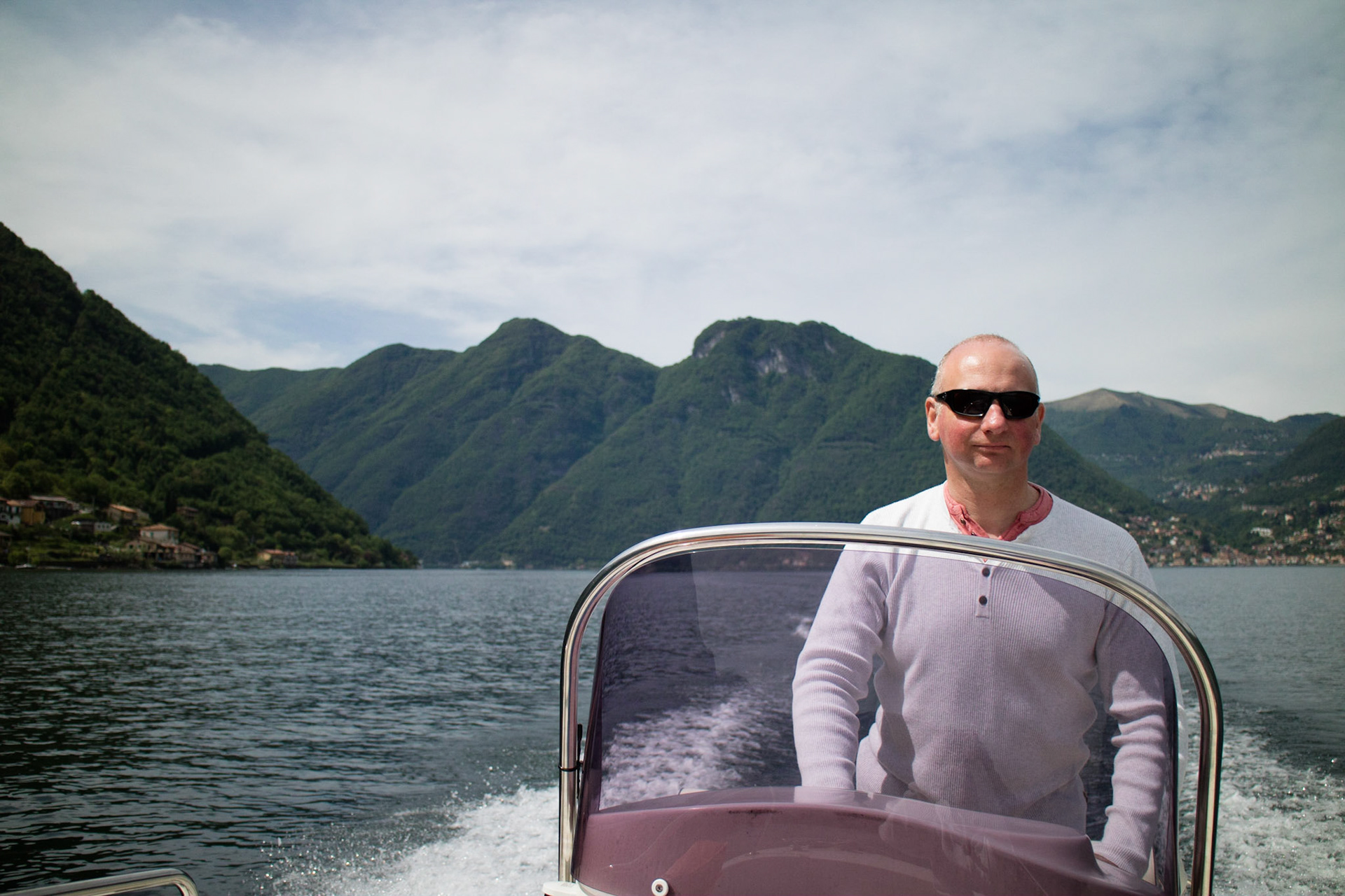 Alex driving our motor boat on Lake Como