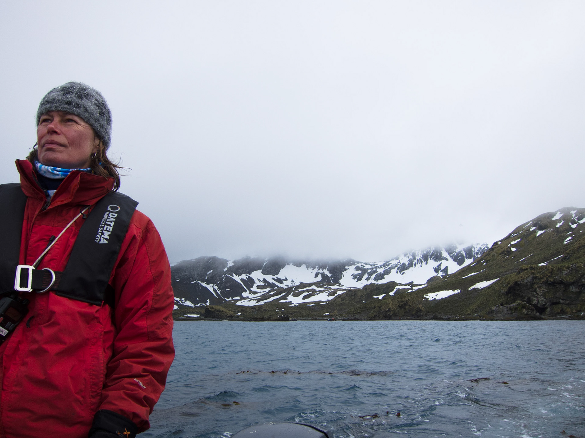 Ali driving a zodiac at Cooper Bay