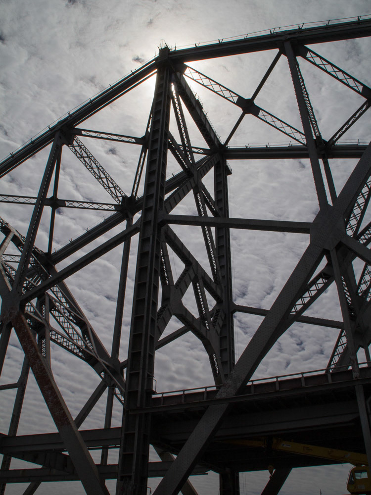 clouds behind the cantilever span of the SF bay bridge